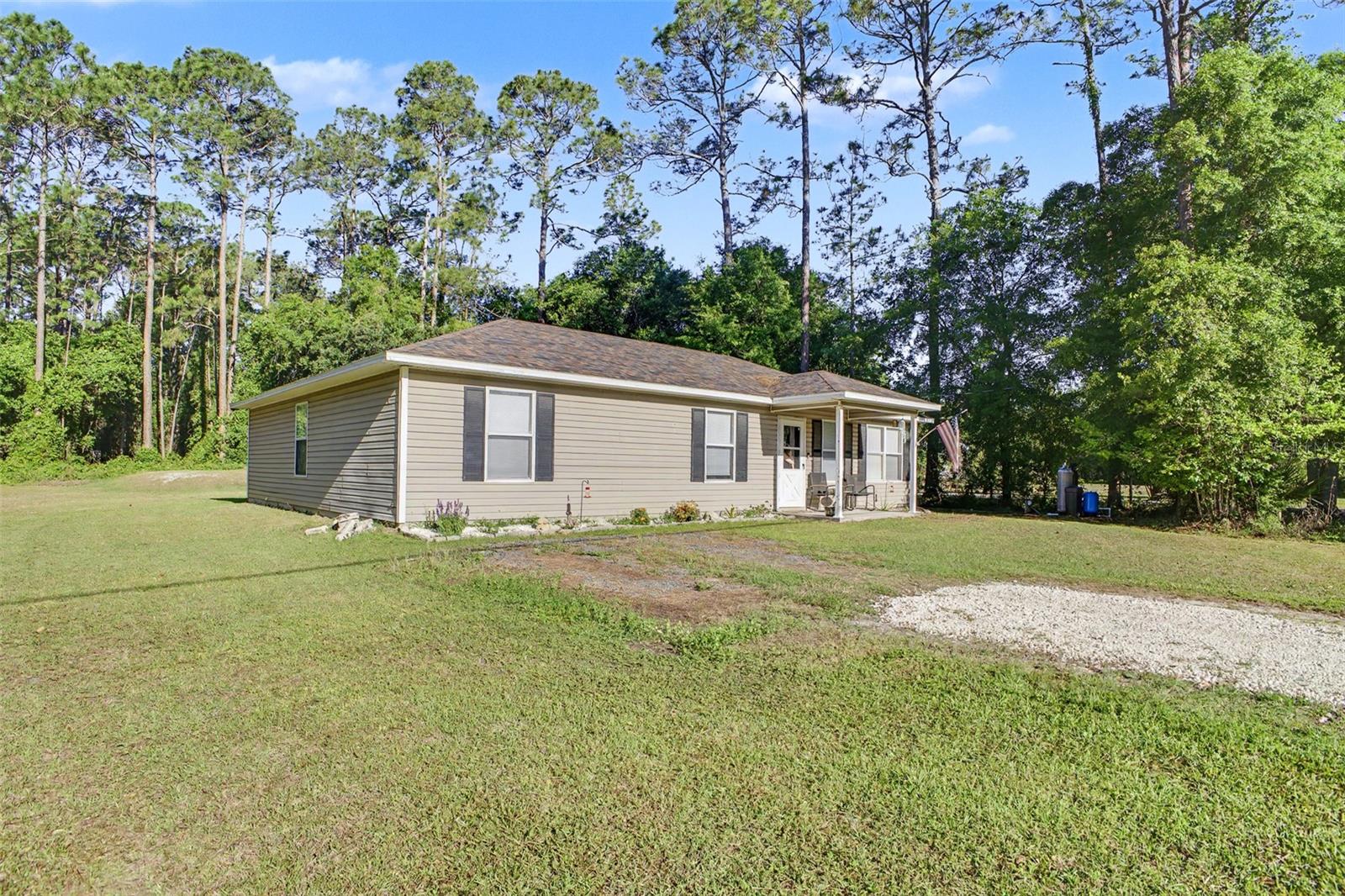 Looking to down size or seeking a starter home?  Take a look at this one then.  This home sits on over an acre and allows for chickens, goats, horses etc.   Living, kitchen & dining are all very open to each other.  A long peninsula in the kitchen makes for ample counter space with black appliances and a window over the sink.  Built in 2008, this home boasts a 2 yr old roof, a well water softener, and a nice 10x10 room built into the back of the house with a separate entrance for a workshop, storage room or a little she shed.  On top of that, there is an additional metal shed for lawn equipment. This home has no carpet; laminate and tile floors throughout. The laundry room is conveniently located in it's own room.  Bring your farm animals and enjoy no HOA!