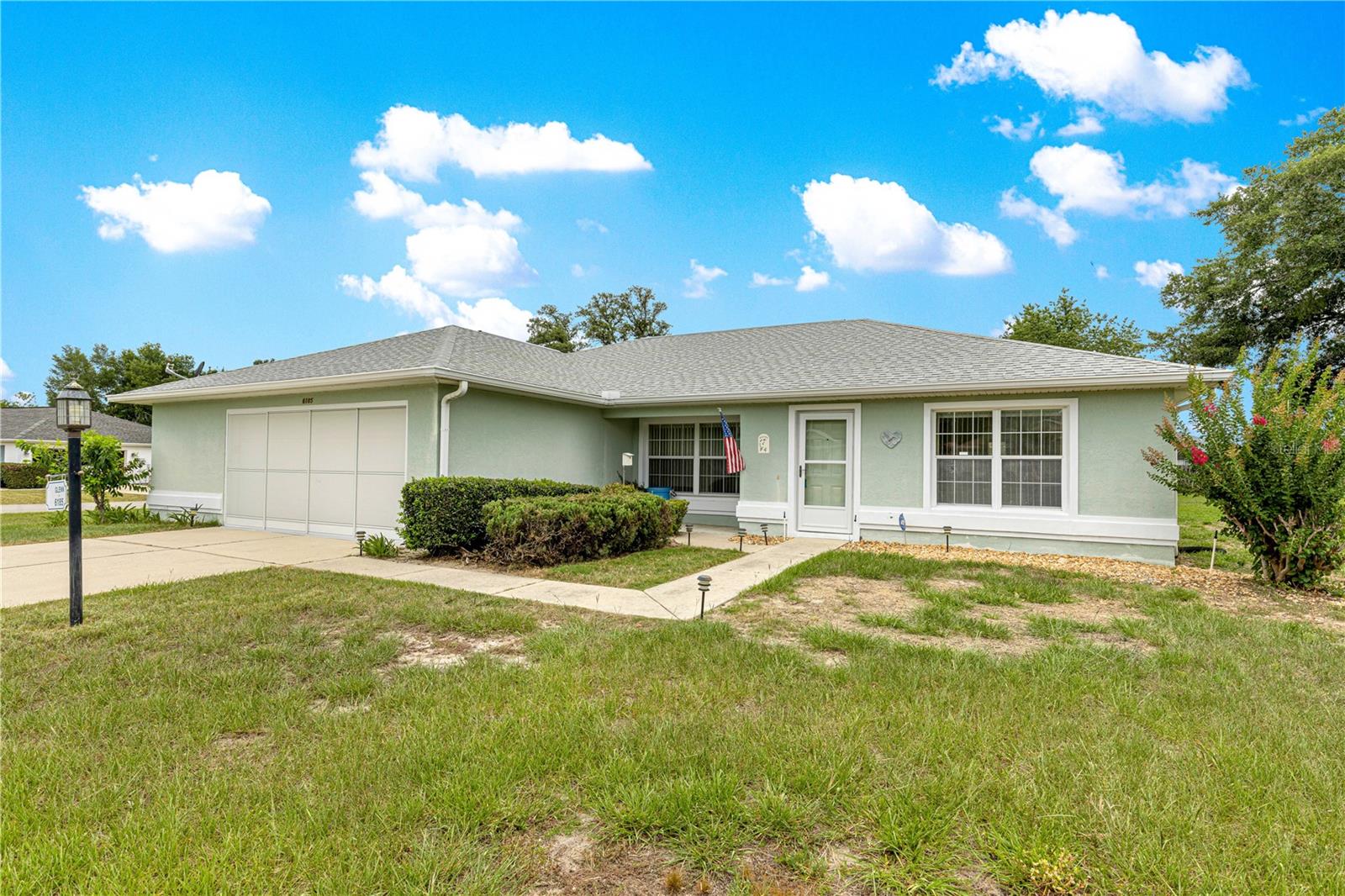 Enjoy an active lifestyle in Marion Landing, where residents have access to their very own bowling alley along with an impressive array of amenities! This well-maintained home is situated on a desirable corner lot with no rear neighbors, offering added privacy and peaceful views of the fenced dry retention area behind the property. The garage  has an exterior door as well an extra storage space.

Major updates provide peace of mind, including a new roof in 2020, air conditioner in 2023, and a new dishwasher and microwave in 2025. The home also features a convenient central vacuum system.

Start your mornings on the charming covered front porch, the perfect spot to enjoy a cup of coffee. Inside, you'll appreciate the spacious open floor plan that allows easy interaction with family and guests while preparing meals. The kitchen offers a large closet pantry, breakfast bar, and plenty of workspace.

One of the standout features is the oversized indoor laundry room, complete with a large utility sink, abundant storage space, and washer and dryer that convey with the home.

The split-bedroom layout provides privacy for both owners and guests. The primary suite features a walk-in closet and an en-suite bath with a walk-in shower and comfort-height toilet. Guest bedrooms are located on the opposite side of the home, adjacent to a guest bath with a tub/shower combination.

Marion Landing residents enjoy exceptional amenities including a clubhouse, swimming pool, fitness center, billiards room, shuffleboard, bowling alley, tennis courts, and pickleball courts. Even better, water, sewer, and trash services are included in the HOA fee, making this home an outstanding value in a vibrant community.
New residents are charged at closing a utility transfer fee of $550, capital investment fee of $1450, and $150 to Leland Management.
SECO is the electric company and  Spectrum is TV/Cable or satellite company.