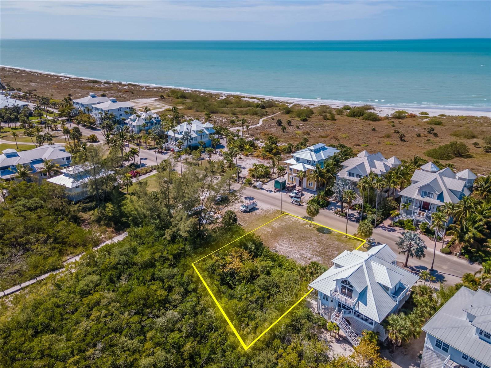 Just reduced! Build your dream island home on this great property! Located within Palm Island Resort, a private community accessible by car ferry only, no bridge, with all the amenities you are searching for; swimming pool, fitness classes, a fabulous tennis program, fun family activities for holidays, and access to 7 miles of beautiful natural beaches. Watch the sunset over the Gulf of Mexico and rise over Knight bay. Island style living, boating, kayaking, shelling and just relaxing waits for you. Join this community like no place else in FL, Palm Island Resort. No vehicles are allowed in the resort, Golf carts, bikes and walking only, so quiet!