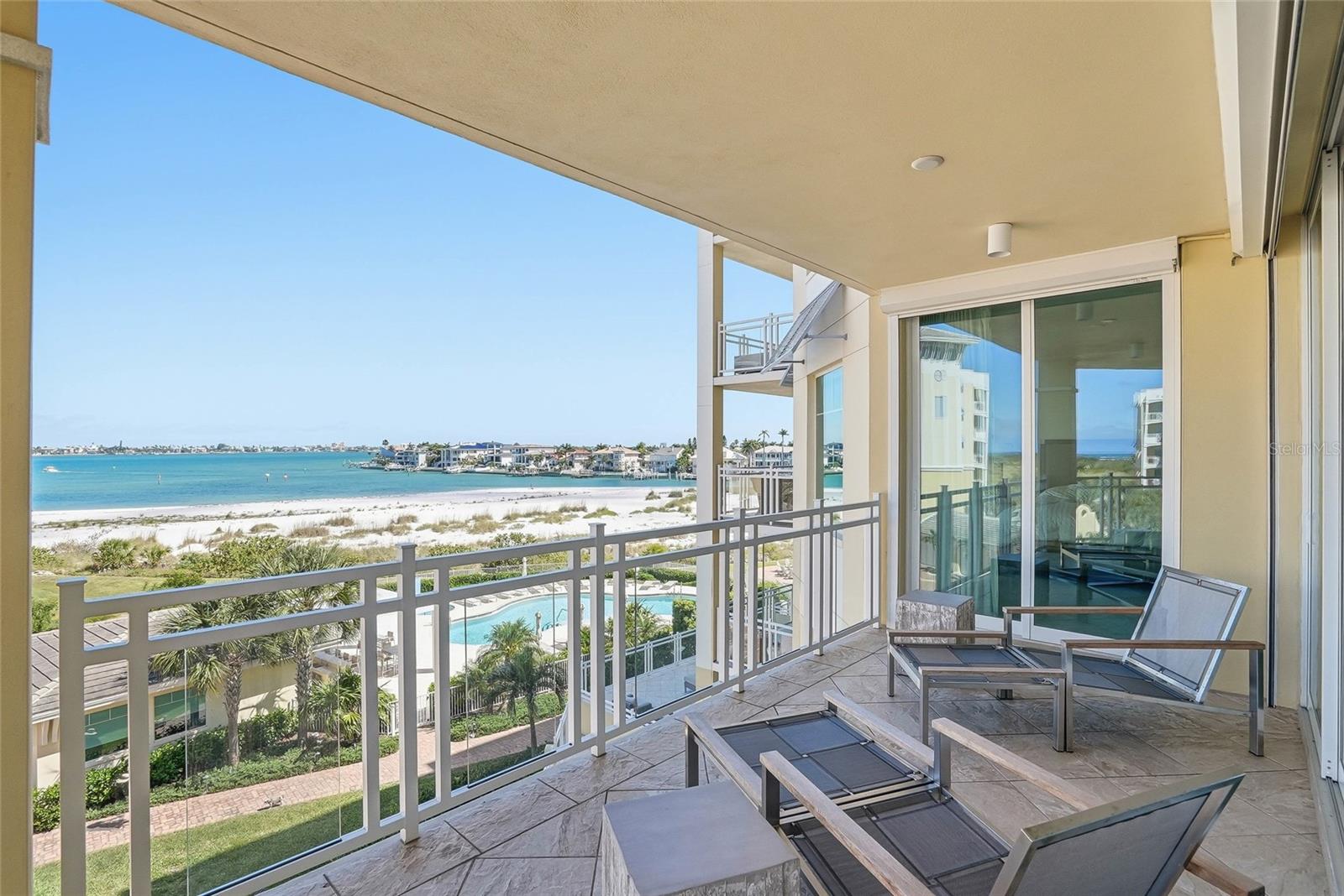 Experience coastal living in the exclusive gated waterfront community of Sunset Pointe at Collany Key on the island of Tierra Verde. This elegant 3-bedroom, 3.5-bath residence offers 2,721 square feet of refined living space with stunning waterfront surroundings and resort-style amenities just moments from the Gulf of Mexico. Built in 2017, this spacious condominium features an open-concept floor plan designed for both everyday comfort and effortless entertaining. Expansive living and dining areas flow seamlessly to a large private balcony through walls of sliding glass doors, filling the home with natural light and capturing beautiful water views and coastal sunsets. The well-appointed kitchen offers generous cabinetry, ample prep space, and a functional layout ideal for gathering with family and guests.
The primary suite serves as a private retreat with balcony access, spacious walk-in closets, and a luxurious en-suite bath featuring dual vanities, a soaking tub, and a walk-in shower. Two additional guest suites each offer their own private baths, providing comfort and privacy for visitors. A convenient laundry and utility room, two assigned under-building parking spaces, and a private storage locker add to the home’s functionality and convenience.
Residents of Sunset Pointe enjoy a collection of resort-style amenities including a waterfront geothermal heated saltwater pool and spa, fitness center, clubhouse, dog park, scenic walking paths, fishing and water access, kayak launch areas, and beautifully maintained grounds throughout the gated community.
Surrounded by the natural beauty of Tierra Verde and nearby Shell Key Preserve, this exceptional location is just minutes from waterfront dining, marinas, boating, and the Gulf beaches, while still offering convenient access to downtown St. Petersburg, Tampa International Airport, and St. Pete-Clearwater International Airport.
A rare opportunity to enjoy luxury waterfront living in one of Tierra Verde’s most desirable communities.