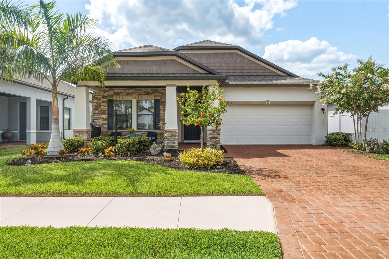 STEP INTO ELEGANCE and comfort with this beautifully maintained 2021 built 3/2/2 with a BONUS ROOM in between the guest bedrooms perfect for an office or additional living space. This home has almost 2000 square footage, showcasing a stunning stone facade and a charming paver lined driveway framed by mature landscaping. A covered, open air front patio welcomes you with a warm, inviting ambiance that sets the tone for the exquisite interior. Designed for the discerning chef, the open concept kitchen dazzles with granite countertops, stainless steel appliances, soft close shaker cabinetry, and a sleek glass subway tile backsplash provides effortless entertaining. Ceramic tile flooring flows gracefully through the main living spaces, enhanced by recessed lighting, crown molding, stylish fixtures, and tasteful blinds paired with curtains still affording abundant natural light.The spacious living room seamlessly connects to a screened lanai, offering expansive picture frame views that create an ideal indoor-outdoor flow for entertaining or unwinding in tranquility. Plush carpeting adorns all bedrooms, including a luxurious primary suite featuring recessed lighting, a walk in closet, and an ensuite bath with double sinks set in Corian countertops and a spacious walk-in shower. A well-appointed middle bathroom serves both the guest suites and the rest of the home with elegance and convenience.Villa Milano is a hidden gem, boasting luxury living in a peaceful neighborhood at an affordable price point. Enjoy LOW HOA fees at merely $115 month, PUBLIC WATER and sewer, inside laundry, NO CDD, UNDERGROUND UTILITIES, sidewalks, PRIVACY GATE, a heated community pool overlooking a tranquil pond, and an inviting clubhouse plus PET FRIENDLY. Ideally located just minutes from Charlotte Sports Park, Tampa Bay Rays Stadium, Charlotte County Fairgrounds, and major shopping centers, with both Manasota Beach and Boca Grande only 30 minutes away, making beach days and daily errands effortlessly accessible.This exceptional home blends modern upgrades, resort-style amenities, and thoughtful design for seamless Florida living. Inquire about ASSUMABLE 3.5% RATE MORTGAGE opportunity for qualified buyers. WOW! Furnishings also available for the right price to make this move effortless. DONT LET THIS ONE SLIP AWAY, hurry  to make this resort inspired sanctuary yours, schedule your showing TODAY!