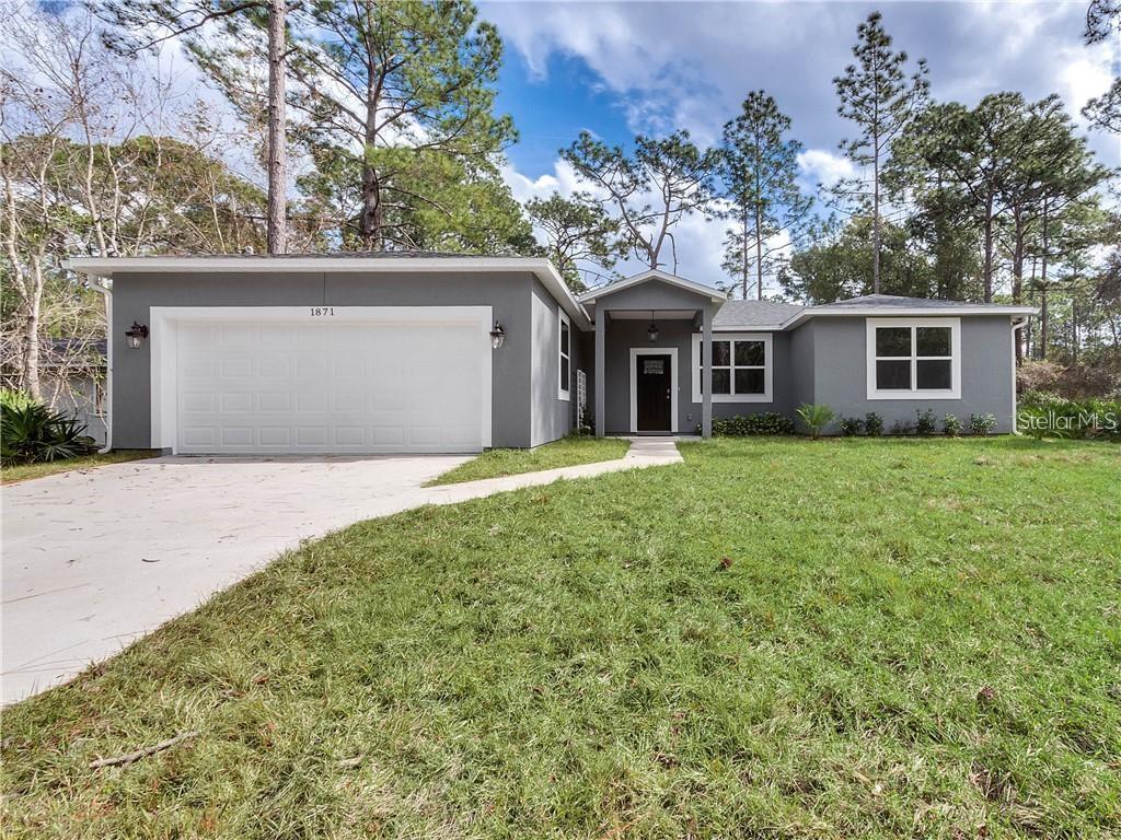 Deland 3 Bedroom 2 Bath Custom Built Home - Built in 2020 l lots of upgrades l move in ready l private lot! This beautiful property is a MUST SEE! 3 bedrooms, 2 bathrooms with 1,796 sq ft on a .26 acre lot. The family room/kitchen combo is spacious and bright thanks to all the windows and sliding glass door that leads to the covered screened in porch and private backyard. The kitchen is AMAZING! Large center island w/bar stool seating, stainless steel appliances, decorative back splash and great color combos. The breakfast area has plenty of space for a large table. Barn doors lead to the utility room and large walk in pantry. The master suite features a large walk in closet and spa like master bathroom. The bathroom boasts his and her vanity, garden tub and huge walk in shower. Additional bedrooms are spacious and share a beautiful guest bathroom. The back covered porch is perfect for morning coffee or evening dinners. The backyard has plenty of room for everyone including the pets! Reverse Osmosis water system installed along with a Water Softener. Don't wait! Make your appointment today to see all this property has to offer for YOU! More pictures coming.. All information is deemed to be correct but not guaranteed.