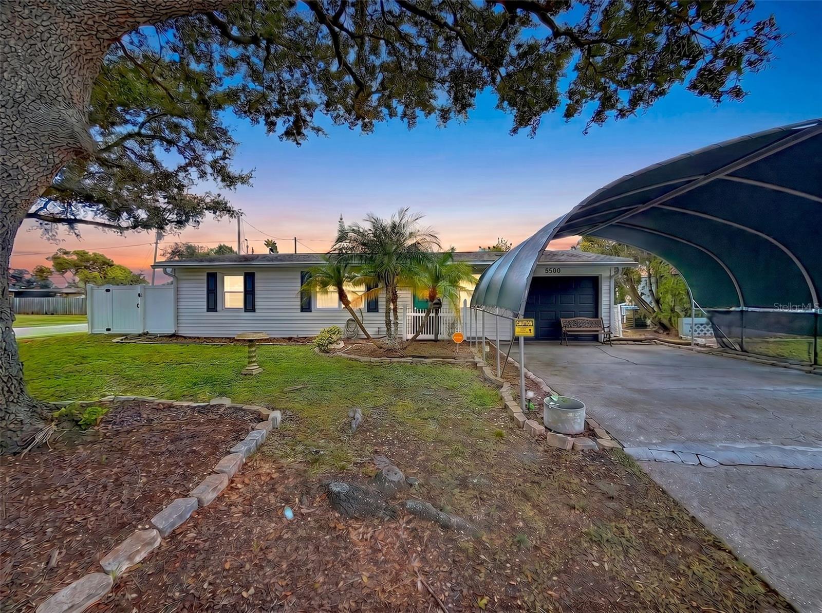 PICK YOUR ROOF COLOR! A brand-new roof will be installed at closing, giving the buyer the opportunity to choose the roof color! This charming and affordable 2-bedroom, 1-bath, 1-car garage home is centrally located in the heart of Pinellas Park. The bright, open living area is filled with natural light, creating a warm and inviting atmosphere. The kitchen features stainless appliances, and the well-maintained A/C has been regularly serviced since 2014. Situated on a spacious CORNER LOT, the home offers hurricane-rated windows and doors, updated electrical panel, a private fenced backyard with plenty of room for a pool, leaf-guard gutters, and a 10' x 10' Bull Shed built in 2018 for additional storage. The security system, including cameras and window sensors, stay with the home. Sold partially furnished. Whether you're a first-time homebuyer, looking to downsize, or searching for a great investment property with quick possession, this home is an excellent opportunity! NO HOA, NO CDD. Conveniently located just minutes from shopping, dining, parks, and 9 miles to Indian Shores Beach!! Move-in ready and competitively priced for a quick sale. Schedule your private showing today!