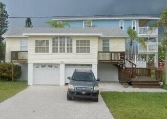 ***PRICE DROP & BRAND NEW EFFICIENT HVAC INSTALLED!!** LIVE THE ISLAND LIFESTYLE IN THIS CHARMING 1940'S - COTTAGE , THIS 3-BEDROOM,1 BATH HOME ELEVATED ABOVE A 2 CAR GARAGE IS JUST STEPS AWAY FROM THE BEACH AND THE BAY, IDEALLY LOCATED IN THE HEART OF BRADENTON BEACH. WHETHER YOU AR LOOKING FOR A PERSONAL RETREAT OR A VACATION RENTAL,THIS PROPERTY ALLOWS SHORT TERM RENTALS GIVING YOU FLEXIBILITY AND A FINANCIAL OPPORTUNITY . ENJOY THE CONVENIENCE OF BEING CLOSE TO SHOPS, RESTAURANTS,AND A FREE TROLLEY SERVICE, PLUS TAKE IN THE BREATHTAKING SUNSETS RIGHT FROM YOUR DOOR STEP. WITH A SPACIOUS CORNER LOT THERE IS ROOM TO INSTALL A POOL OR CREATE YOUR DREAM OUT DOOR  PATIO - DON'T MISS OUT ! MAKE THIS ISLAND GEM YOURS.