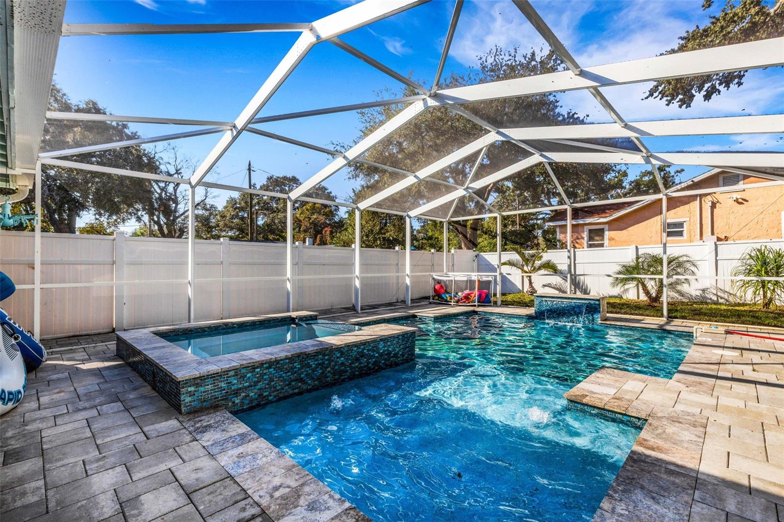 This Beautiful Well Maintained Pool Home is an Active AirBnB AND an Ideal Vacation Home. Turnkey and Fully Furnished, this is a perfect home for an Investor, or Family who wants to enjoy the wonderful Florida Climate and Beaches of the Gulf Coast for family get-togethers. Located in Largo FL, just minutes from the SANDY BEACHES of the Gulf Coast, like Indian Rocks Beach or Belleair Beach, it is a quick drive or short bike ride to the ocean. NO HOA FEES!  And SHORT TERM RENTALS ARE ALLOWED! Home is registered with the city of Largo as a short term rental and has passed inspection to operate as such. There is a newer and fully automated inground POOL & JACUZZI, and a children's park is only a block away, in the quiet neighborhood. The famouse Pinellas trail is only a minute from the home for biking and walking. Home improvements include: ELECTIRIC PANEL REPLACED,  2025, NEW ROOF, 2022. New water heater, 2024, new external paint, 2022, Heated Pool with Spa, Pool Screen Enclosure, 2023, Irrigation System, Pavers on both sides of house, Vinyl Fence, Hard wired smoke detectors, Emergency lighting, Ceiling fans, telelvision, and spotlights on porch. Included in sale if desired: washer and dryer (new in 2024) refrigerator (new in 2022) furniture, 4 televisions and supplies (dishes, towels, sheets, blankets, pool toys ect.)