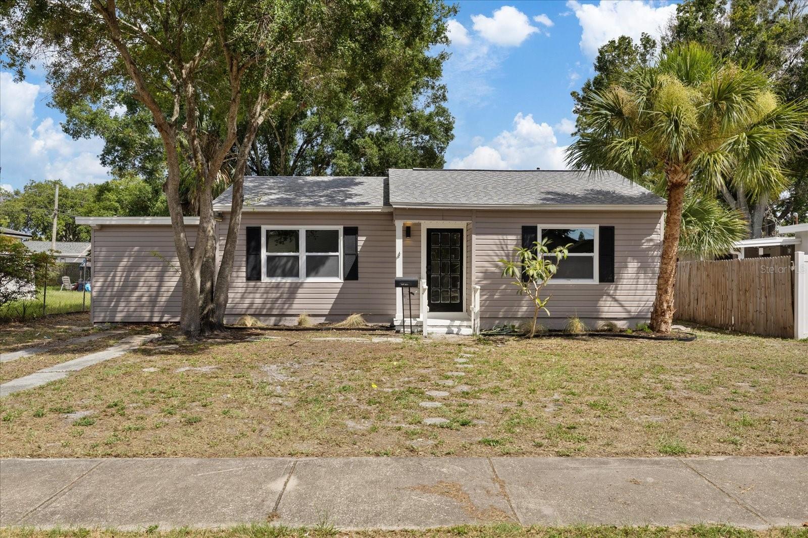 Welcome to this beautifully renovated 3-bedroom, 2-bathroom home perfectly situated in one of St. Petersburg's most desirable locations, just off 4th Street North. Offering the perfect blend of modern style, quality craftsmanship, and everyday convenience, this move-in-ready residence has been thoughtfully updated from top to bottom so you can simply unpack and enjoy.
Inside, you'll find a bright, open living space featuring brand-new flooring, fresh interior paint, new trim, new baseboards, and new interior doors that create a clean, contemporary feel throughout. The stunning new kitchen is designed to impress with stylish finishes, modern cabinetry, and ample space for cooking and entertaining. Both bathrooms have been completely remodeled with beautiful designer finishes that bring a touch of luxury to your daily routine.
Major system upgrades provide peace of mind for years to come, including a brand-new HVAC system with all new ductwork, hurricane-impact windows, updated electrical and plumbing, and a new water heater. Every detail has been carefully considered, making this home as functional as it is beautiful.
Step outside to discover an oversized, fully fenced backyard offering endless possibilities for entertaining, pets, gardening, or even adding a pool. Relax with your morning coffee on the shaded front porch or unwind on the covered patio overlooking the private backyard. A convenient storage shed provides additional space for tools, lawn equipment, or hobbies.
Location truly sets this home apart. Nestled just minutes from vibrant downtown St. Petersburg, you'll enjoy easy access to countless restaurants, shopping, parks, and entertainment. With quick access to I-275, commuting to Tampa, the airports, and surrounding areas is effortless while still allowing you to enjoy everything that makes St. Pete one of Florida's most sought-after places to call home.
This is the turnkey home you've been waiting for—beautifully renovated, centrally located, and ready for its next owner. Schedule your private showing today before this exceptional property is gone!
