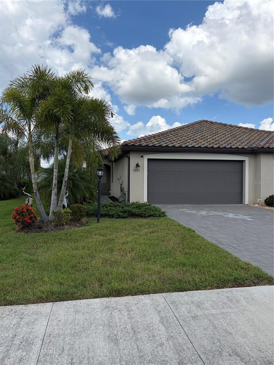Welcome to this beautifully upgraded 2022-built villa located in the highly sought-after gated community of Lorraine Lakes in Lakewood Ranch! This spacious 2-bedroom, 2-bath residence offers 1,557 SF of thoughtfully designed living space with an open-concept floor plan, high ceilings, and abundant natural light throughout.

Recent upgrades and improvements include crown molding throughout the villa, a complete interior painting refresh, water softener system, upgraded yard fencing, extended lanai area for enhanced outdoor living, and custom garage shelving for additional storage and organization.

The kitchen opens seamlessly to the main living and dining areas, creating the perfect space for entertaining or relaxing. The primary suite features a spacious walk-in closet and private bath, while the split-bedroom layout provides privacy for guests or a home office setup.

Enjoy Florida living year-round from the extended screened lanai overlooking a peaceful pond view at the rear of the home - the perfect setting for morning coffee, relaxing evenings, or entertaining guests outdoors. Additional highlights include an attached 2-car garage, concrete tile roof, masonry construction, and low-maintenance living.

Located within the amenity-rich Lorraine Lakes community, residents enjoy resort-style pools, clubhouse, fitness center, tennis courts, pickleball, walking trails, and more. Conveniently situated near top-rated schools, shopping, dining, golf, UTC Mall, I-75, and the Gulf Coast beaches.

Move-in ready and ideally located in one of Lakewood Ranch's fastest-growing communities!
