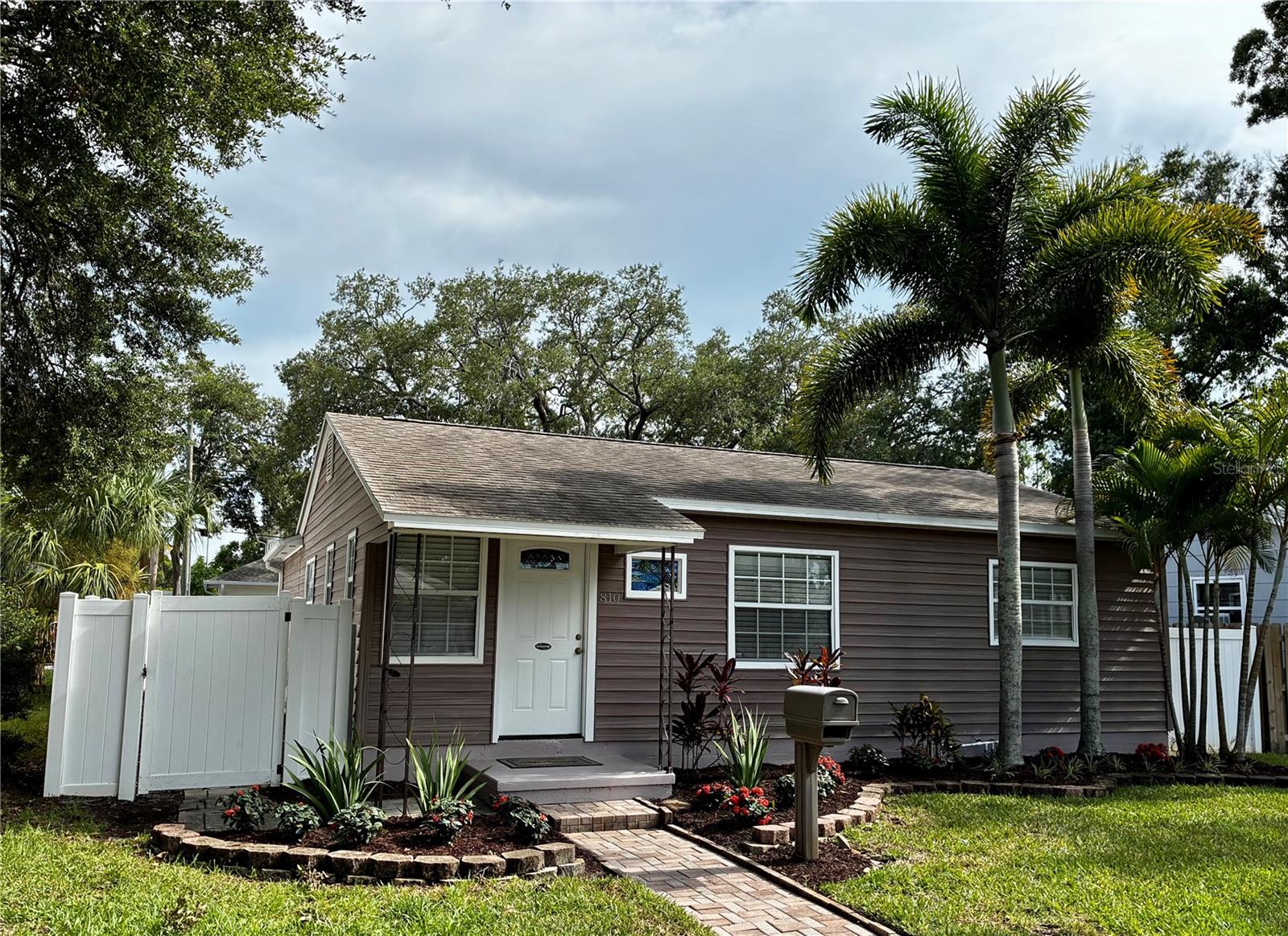 Don't miss this welcoming and well-maintained 2-bedroom, 1-bath home that blends charm with smart upgrades. Inside, the kitchen stands out with beautiful white cabinets, granite countertops, and a clean, modern feel. The home also features a flexible bonus room, perfect for a home office, studio, or additional living area. Recent improvements include a back patio, and an instant tankless water heater, adding efficiency and peace of mind. Outdoors, enjoy a poured cement patio topped with a lovely gazebo, ideal for gatherings or quiet evenings. The property also offers additional parking in the back, a valuable convenience for guests, work vehicles, or extra storage. Enjoy this wonderful location minutes to Downtown, I275 access, beaches, shopping and more.