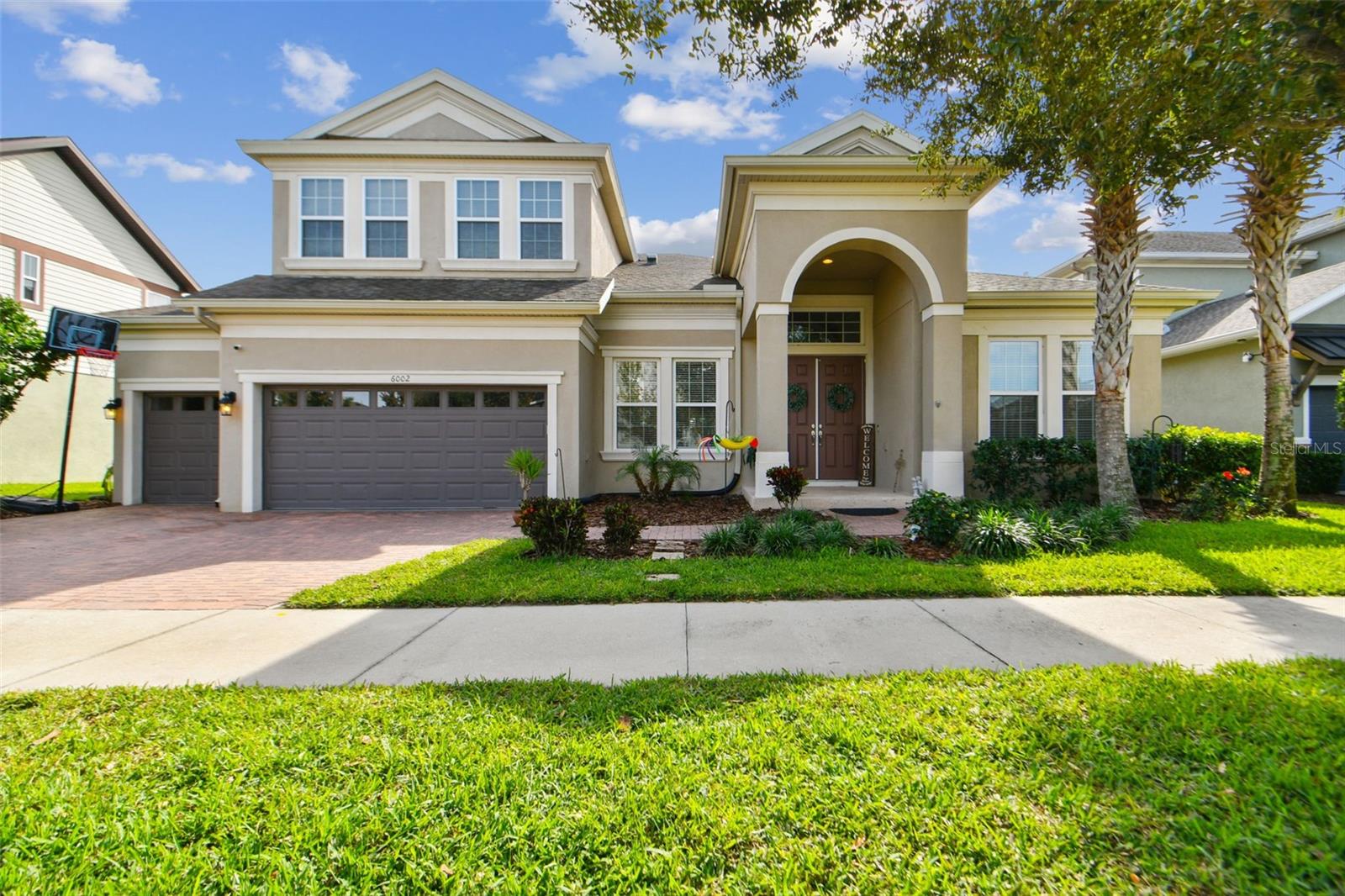 **CORPORATE RELOCATION OFFERING UP TO $25K TOWARDS RATE BUY-DOWN, CLOSING COSTS OR BOTH** Welcome home to luxurious resort-style living with top-rated schools! THIS FISHHAWK RANCH WEST EXECUTIVE HOME is situated on an oversized fenced lot with a CONSERVATION VIEW OUTDOOR OASIS! This distinguished Homes By WestBay Key Largo II is a 5/4/3 with a Bonus Room, Home Office PLUS Formal Dining or Living room. The beautiful open floor plan is loaded with updates and and boasts upgraded flooring and soaring 12 foot ceilings in all main living areas. A paver driveway and double front doors welcome you home into the lovely Foyer and the Formal Dining or Living Area with crown molding and elegant wainscoting. To the right of the Foyer is the Home Office with crown molding and French doors.  This dramatic entry continues to the Spectacular Grand Room showcasing the Living Room, Dining Area and the GOURMET KITCHEN! Loaded with space for entertaining, designer finishes include an all-stainless kitchen with upgraded appliances, 42-inch cabinets, custom lighting, backsplash, wall oven, gas cooktop, granite counters and dining island. The STUNNING HEART OF THIS HOME features extended sliders flowing to the covered and screened OUTDOOR LIVING AREA that overlooks the POOL AND BREATHTAKING GREENBELT VIEW! The secluded, spacious Master Suite features dual walk-in closets and a luxurious master ensuite with dual vanities, garden tub and an oversized walk-in shower. Three additional bedrooms, two additional baths, one which also serves as a pool bath, a spacious laundry room with a built-in closet complete the massive main floor. Upstairs is the Bonus Room, fifth bedroom plus another full bath. Additional upgrades include a Whole-Home WiFi system, Polyaspartic coated garage floor with overhead storage, and an upgraded pool filtration system. Zoned for A-rated schools, FishHawk Ranch West is a resort-style community that offers numerous amenities including a Central Park, playground, community pool and splash park, Lake House, Fitness Center, Game Room, and miles of walking and biking trails. **CORPORATE RELOCATION HAS THIS HOME PRICED TO CLOSE QUICKLY SO DON'T WAIT AND SCHEDULE YOUR SHOWING ASAP**
