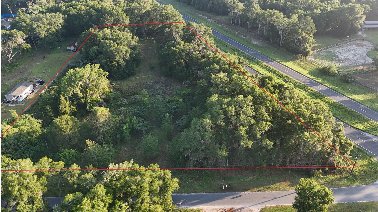 Bring your plans this parcel is just 18 miles from the World Equestrian Center!  You can design your dream home or farm on this 3.26 +/- acres.  Property is a corner parcel with road frontage on Hwy 441 and NW 145th Street for easy access to Ocala, Gainesville or WEC.     Located in the Horse Capital of the World this gives you the opportunity to design your dream barn, paddocks or just the perfect dream home.  Property is zoned A-1 so you can have your own private garden, chickens, horses, or cattle, if you wish.