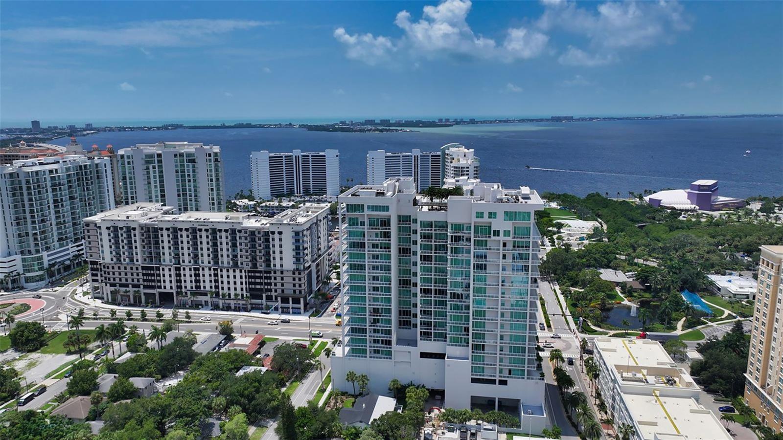 Enjoy refined elevated Living at The BLVD offering more than a home—this northwest corner 4-bedroom unit delivers a premier vantage to Sarasota’s spectacular bay and city skyline views from sunrise to sunset. Perfectly positioned in the Bayfront District, this modern masterpiece rises above the ordinary to bestow a stunning expression of Sarasota living. Expansive floor-to-ceiling glass along with a 1,356 sq ft wraparound balcony reveal sweeping unobstructed bay vistas and glittering city views. A private elevator entry introduces a flowing 3,698 sq ft layout with tons of natural light designed to showcase the view from nearly every space. The generous great room is designed for both comfort and entertaining, highlighted by soaring tray ceilings, a custom wooden slatwall, and wood-planked tile flooring. The kitchen serves as a striking focal point, blending refined cabinetry and a tailored tile backsplash for a clean, contemporary aesthetic. A quartz-clad island provides abundant workspace and storage, while premium Thermador appliances—including convection cooktop, built-in wall oven, wine refrigerator, and dual pantries with custom shelving—cater to both everyday living and elevated culinary pursuits. The primary suite offers a tranquil retreat, featuring two walk-in closets and a spa-inspired bath complete with a soaking tub and an expansive glass-enclosed  shower featuring luxurious his-and-her Rain Head, enhanced with integrated steam for a spa-like retreat. An additional oversized bedroom suite currently used as a bonus room could become the primary bedroom. Two additional bedroom suites each enjoy private terrace access and indulgent en-suite baths. A stylish powder room and a well-appointed laundry room complete the interior.
BLVD is an intimate, boutique residence with just forty-nine homes, distinguished by its curated, hotel-inspired amenities and full-time concierge services. Residents enjoy an elegant social lounge with service bar, a state-of-the-art fitness center, conference facilities, a temperature-controlled wine room with private secured storage, an indoor driving range, and a dedicated dog grooming suite. An expansive outdoor terrace provides additional lounge spaces and thoughtfully designed pet amenities. At the pinnacle of the building, Sarasota’s premier rooftop retreat offers an unmatched setting for relaxation and entertaining, featuring a stunning zero-horizon pool, inviting lounge areas, a covered summer kitchen, and a fire pit overlooking the bay. Residence 701 reflects the very essence of the Sarasota lifestyle—where refined luxury and effortless sophistication converge. And COMING SOON - 1000 NORTH Sarasota, an exclusive members-only club located on the bottom floor of the BLVD and centered in the heart of the city’s cultural corridor. This private retreat will offer refined dining and handcrafted cocktails. From waterfront strolls and acclaimed dining to world-class arts and cultural events just moments away, BLVD is as much a destination as it is a home.