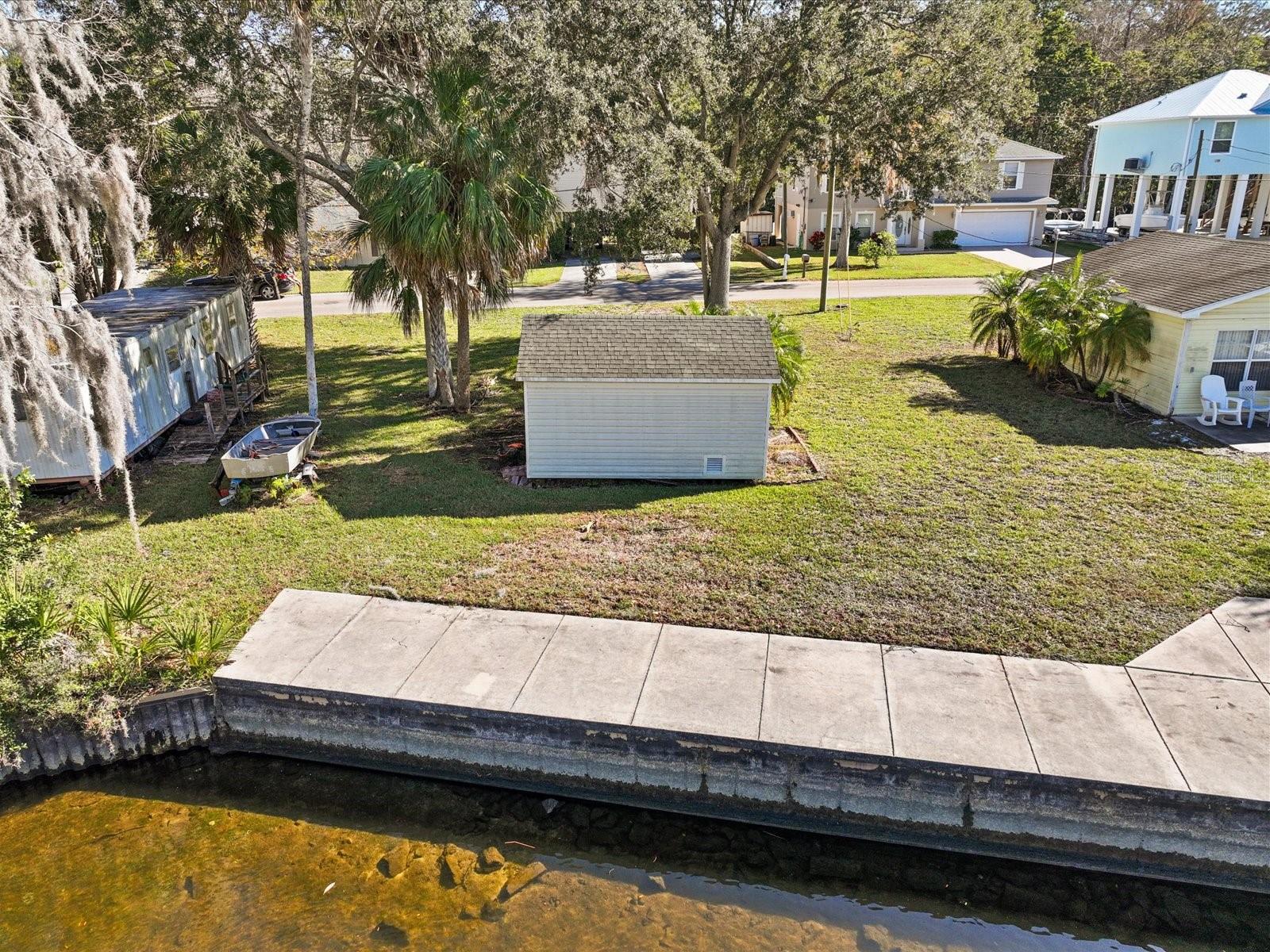 Seize an extraordinary opportunity to own 50 feet of prime riverfront on the world-famous Weeki Wachee River, one of Florida’s most beautiful and iconic spring-fed waterways. Located along the river’s legendary 7.5-mile crystal-clear stretch, this property offers a rare blend of natural beauty, recreational freedom, and rich Old Florida history.

Fed by the renowned Weeki Wachee Springs, the river maintains a constant 74-degree temperature year-round, creating an ideal setting for kayaking, paddleboarding, swimming, boating, and wildlife viewing. The springs—famous since the 1940s for their historic live mermaid shows—contribute over 112 million gallons of fresh water daily, ensuring pristine clarity and steady flow. As the river winds through state parklands, it eventually meets the Mud River and flows directly into the Gulf of Mexico at Bayport, offering seamless access to both freshwater and saltwater adventures with no fixed bridges.

This versatile property is zoned R-3, offers no HOA restrictions, and allows for short-term rentals, making it ideal for a future custom riverfront home, investment property, or a unique RV retreat. Enjoy watching manatees and dolphins glide by your backyard while taking advantage of excellent fishing opportunities for both freshwater and Gulf species.

An adjacent parcel is also available, presenting a rare opportunity to expand your riverfront to an impressive 104 feet.

Located in Weeki Wachee Gardens, a quiet, spring-fed riverfront community in Hernando County, this hidden gem is just 60 minutes north of Tampa International Airport via the Suncoast Parkway. Tucked away from US-19 and SR-50, the neighborhood captures the essence of Old Florida living—peaceful, secluded, and timeless—while still offering convenient access to modern amenities.

Whether you’re seeking a private riverfront retreat, a recreational getaway, or a future dream home site, this Weeki Wachee River property delivers a truly one-of-a-kind Florida lifestyle.