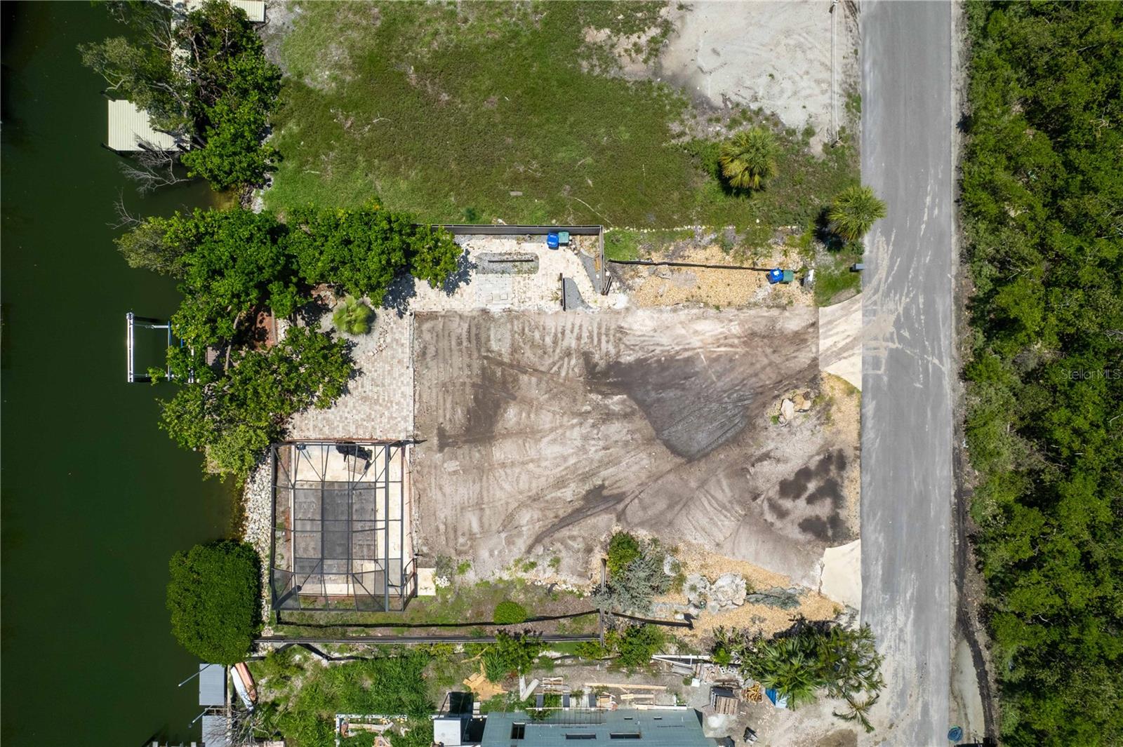 Discover the exceptional potential of 640 Lyons Lane, a perfectly situated vacant lot on a unique street in North Longboat Key, with homes only on one side and protected wetlands on the other. This property offers an outstanding opportunity to build your dream residence in the sought-after Longboat Key with expansive views over the tranquil canal. Adding to its allure, the property includes a newly installed pool and a convenient boat dock with a 10,000 lb lift, which can all be seamlessly integrated into the future home. Whether you're looking to create a permanent residence or a luxurious vacation retreat, 640 Lyons Lane offers the ideal canvas. Don't miss this opportunity to own a piece of paradise in Longboat Key, with proximity to pristine beaches, golf courses, and fine dining.