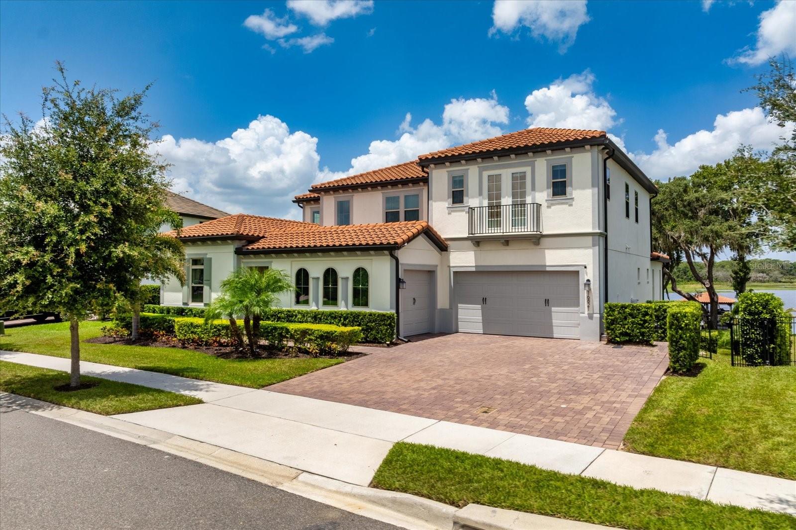 Stunning Designer Home in Exclusive Gated Community Near Horizon West, Windermere, and Downtown Winter Garden. No detail was overlooked in this custom-upgraded 7-bedroom, 5.5-bath estate offering a rare combination of luxury-focused design, wellness-minded living, and high-function luxury. From bespoke ceiling and wall treatments to curated finishes in every room, this home showcases intentional design at every turn. A striking slab of Italian marble creates a dramatic focal point in the main living area, while unique wallpaper choices from Gucci wallpaper in the powder room to gold-leaf and natural grass cloths throughout add rich layers of texture and refinement. Created with wellness in mind, all paints used are low-VOC for optimal indoor air quality. Built-ins, wall finishes, furnishings, and furniture are made from clean, sustainable, and high-end materials. Over $40,000 worth of gorgeous designer light fixtures are thoughtfully placed throughout, adding brilliance and elegance to every space. Enjoy peace of mind with a whole-house water purification system that enhances both your health and your skin and hair. A natural gas-powered generator provides reliable backup power, while the heated pool and hot tub provides year-round relaxation and can be heated simultaneously. The private dock accommodates boats up to 25 feet, and a French drain system with pump ensures water management and flood protection.The dedicated media room is designed for the ultimate movie-night experience, featuring tiered theater seating, blackout shades, and a built-in wet bar, perfect for entertaining or relaxing in comfort and style. Additional features include Hurricane-rated drop-down screen on the balcony and an Extended driveway. Tucked within one of the only gated communities in this part of Winter Garden, this home offers both prestige and convenience with quick access to Horizon West, Downtown Winter Garden, and Windermere. Enjoy Johns Lake living at its best. From boating and fishing to stunning sunset views. A true blend of luxury, wellness, and location. 

Click the tour links for floor plans, additional videos and an interactice map!