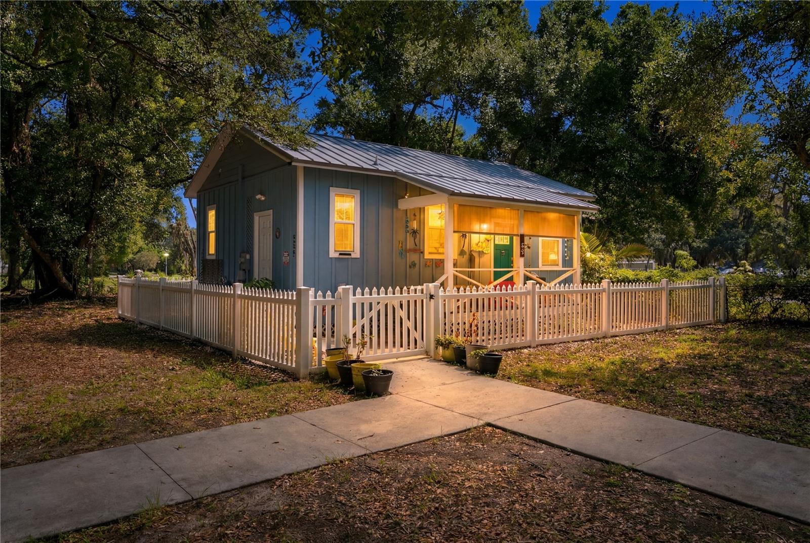 Welcome to this delightful cottage nestled inside a warm and charming community, just minutes from the heart of downtown Bradenton! Built in 2022, this newer gem offers the perfect blend of cozy cottage living with modern touches, featuring a bright and open kitchen with soaring high ceilings that create an airy and inviting atmosphere. The generously sized bathroom adds an extra touch of comfort and luxury to this already impressive home. Everyday living is made easy with the convenience of an inside laundry and generous storage throughout. To top it all off, the low HOA fee of just $150/month covers both your water and ground maintenance, making this truly stress-free living at its finest. Located in one of Bradenton's most up-and-coming areas, you'll be perfectly positioned to enjoy everything this rapidly growing and exciting community has to offer. Whether you're a first-time buyer, downsizer, or investor, this charming cottage is the perfect place to call home — don't miss it!