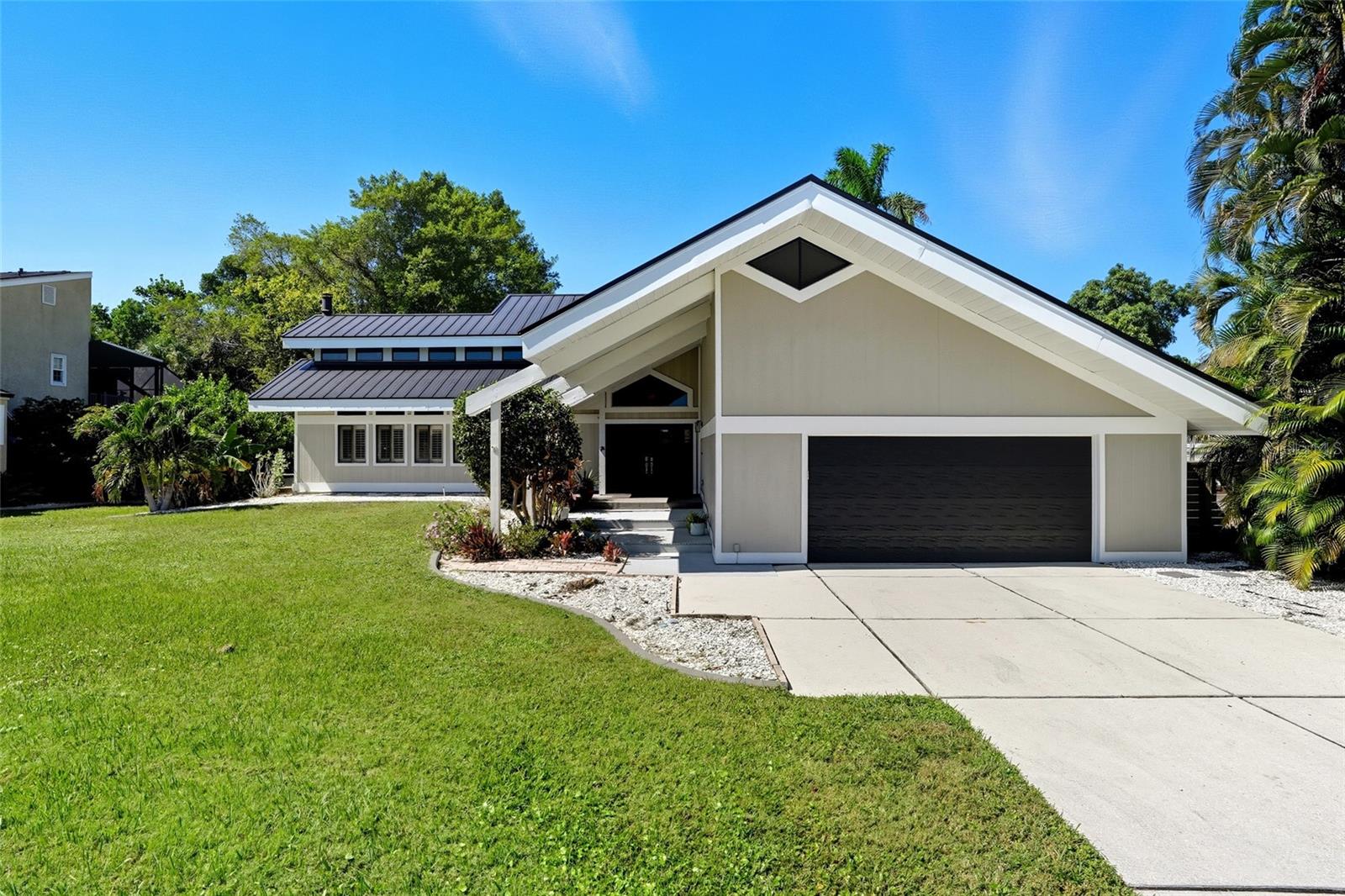 NEW PRICE $575,000 - Beautiful Two-Story Home in the Heart of Fort Myers! NO HOA!! Discover this stunning 3-bedroom, 2-bathroom home perfectly situated in one of Fort Myers’ most desirable and peaceful neighborhoods. From the moment you arrive, you’ll be captivated by the beautiful curb appeal and tranquil surroundings. Metal Roof installed 2022! Step inside to find high vaulted ceilings accented by architectural wood beams and an abundance of natural light streaming through large windows. The interior features ceramic tile and luxury vinyl plank flooring throughout — no carpet! The modern upgraded kitchen boasts stainless steel appliances, sleek finishes, and ample cabinet space, making it perfect for entertaining. The spacious living room includes a cozy wood-burning fireplace and doors leading out to the pool deck area, which is partially covered and fully fenced for privacy — ideal for relaxing or hosting gatherings. Downstairs, you’ll find two bedrooms, a full bathroom, and a separate laundry room for convenience. Upstairs is the primary suite, complete with a loft area overlooking the living space below. The primary bedroom features vaulted ceilings, sliding glass doors leading to a walkway balcony overlooking the pool, and a large spa-inspired bathroom with double vanities, a walk-in shower, a soaking tub, and a huge walk-in closet. Outside, the fenced yard offers both beauty and privacy, creating your own personal retreat. Centrally located near McGregor Blvd, you’ll enjoy easy access to all of Fort Myers’ best dining, shopping, entertainment, golf, and tennis. A boater’s dream, this home puts you just minutes from the water with tons of destinations to choose from for leisure cruises to sport fishing — 20 minutes to Sanibel Island, 20 minutes to downtown Fort Myers, and 15 minutes to downtown Cape Coral. This home truly combines modern comfort, style, and location — the perfect place to enjoy the Florida lifestyle! (House did not flood)