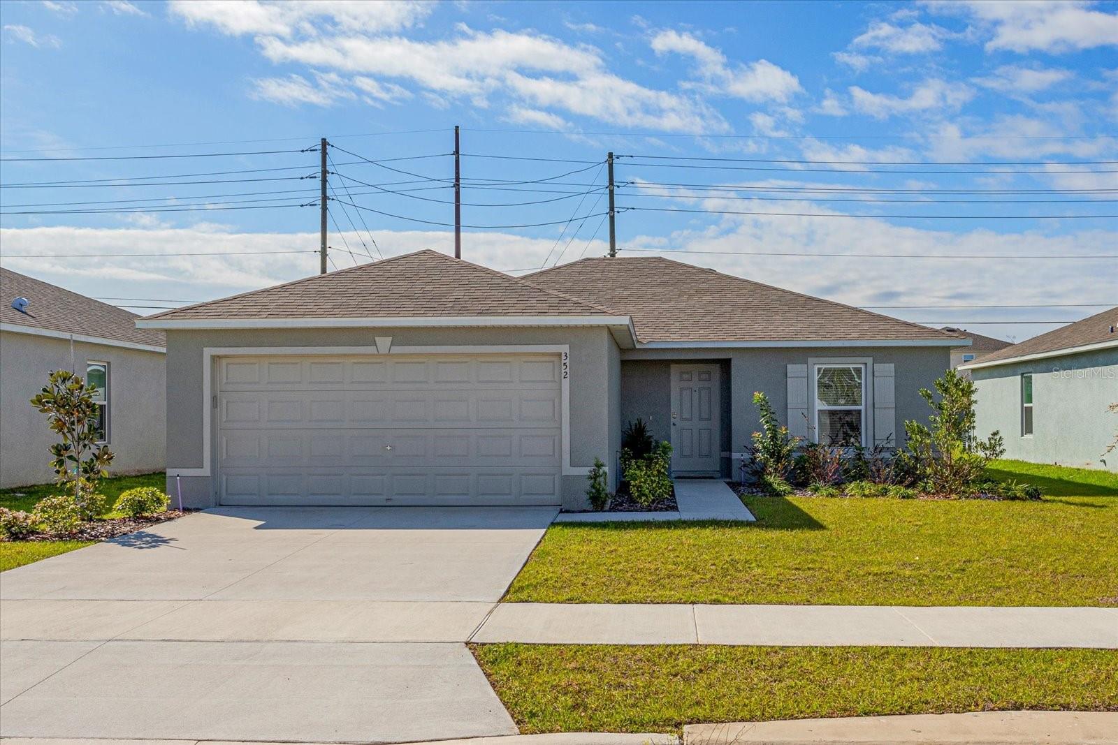 Looking for a great home or an investment home? Why wait for a new build when this beautiful newer home is move in ready. It comes with all appliances including a SS refrigerator and washer and dryer, as well as all blinds and a garage door opener. Best of all there is no CDD fee in this community. This 3-bedroom, 2-bathroom home offers an open concept living which is great for entertaining. The kitchen has gorgeous granite counter tops, shaker style cabinets and a large breakfast bar that overlooks the living room. The laundry room is just off the kitchen leading to the garage with beautiful epoxy floors. No details have been left out in this cute home. The shaker cabinets and gorgeous countertops continue into the master bathroom as well as the guest bathroom. The spacious great room has sliders leading to the private backyard with no rear neighbors. This home is definitely worth checking out!