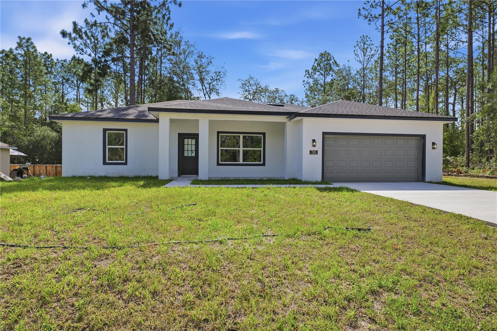 Brand-new construction featuring 3 bedrooms, 2 bathrooms, and contemporary design in the heart of Citrus Springs. Move-in ready, this beautiful residence blends style, comfort, and functionality with an open-concept floor plan designed for today's lifestyle. The spacious primary suite offers a large walk-in closet, while the two additional bedrooms include built-in closets, providing excellent storage and organization.

The bright living and dining areas flow seamlessly into a stunning kitchen appointed with solid wood cabinetry, elegant quartz countertops, premium appliances, and generous workspace—perfect for everyday living and entertaining. Every detail has been thoughtfully selected to combine beauty and practicality.

Conveniently located near major roadways for easy commuting, this home is also close to everyday essentials and local attractions, including Publix Super Market, CVS Pharmacy, Walgreens, restaurants, shopping centers, parks, and the scenic Withlacoochee State Trail. Nearby schools, medical services, and recreational amenities further enhance the appeal of this growing Citrus Springs community. A perfect opportunity to enjoy modern living in a desirable Central Florida location.