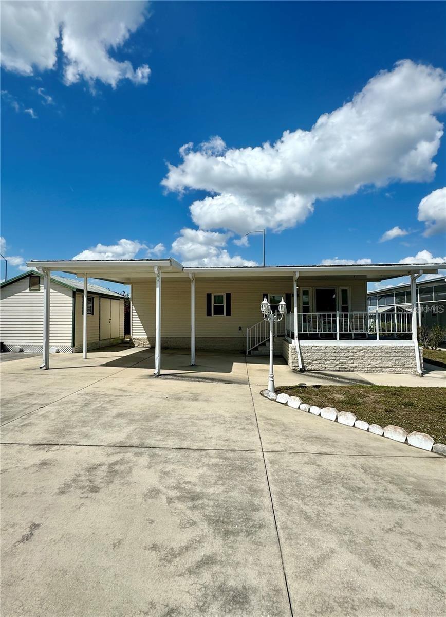 SELLER WILL PAY ONE YEAR OF HOA'S WITH PURCHASE OF PROPERTY!  Buy the home as is!  With a few updates, this home has lots of potential!  Another option is lots can be split.  Live on one lot & sell or rent other lot!  MOTIVATED SELLERS WITH LOTS OF OPTIONS! Welcome to DEER CREEK RV GOLF & COUNTRY CLUB!  It’s the perfect time to purchase your new FLORIDA GETAWAY!  Whether you are looking for a sunny place to winter or a full-time residency, this two-bedroom, two-bath, well-maintained park model is perfect!  Situated on two lots in Osprey Point, this home boasts an open floor plan with living, kitchen & dining room! Sliding doors off the kitchen lead to the Florida Room overlooking the back yard!  Beautiful green space with lots of flowering bushes & trees!  The large, covered patio/carport is a great place for entertaining with family & friends!  There’s plenty of parking for your cars & golf carts plus a shed for storing your golf clubs & toys.  You’ll love sipping your coffee or reading your favorite book on the 12 x 12 front deck!  The Osprey Point Community Clubhouse, Pool, Hot Tub, Shuffleboard Courts & many activities are just a golf cart ride away!  If you love RESORT style living, this is the place for you & perfect for guests!  Deer Creek Community also has a MAIN CLUBHOUSE offering a variety of social events throughout the year such as Karaoke, Trivia, Line Dancing, Crafts, Swing Dancing & more!  Soak up the sun at Deer Creek’s MAIN pool, cabana & hot tub area! Try water volleyball, pickleball, tennis, shuffleboard or pool aerobics!  Love golfing? Check out Deer Creek’s 18 Hole Executive Golf Course Leagues & shopping at the Pro Shop! The Tiki Bar is a great place to meet new friends with occasional live bands & music! The Greenside Grill is perfect for onsite dining!  Deer Creek is centrally located in Davenport just 20 minutes from Disney & all the attractions that families enjoy! Hop on your golf cart & ride to many restaurants & shops nearby. Bealls, Marshalls, Target & Star Bucks are in Posner Park less than a mile away! Call today to view this HIDDEN GEM in sunny Florida! Just 1.5 hours to each COAST! A new Publix is opening soon just across the street!  Let us show you Deer Creek RV Golf & Country Club today!