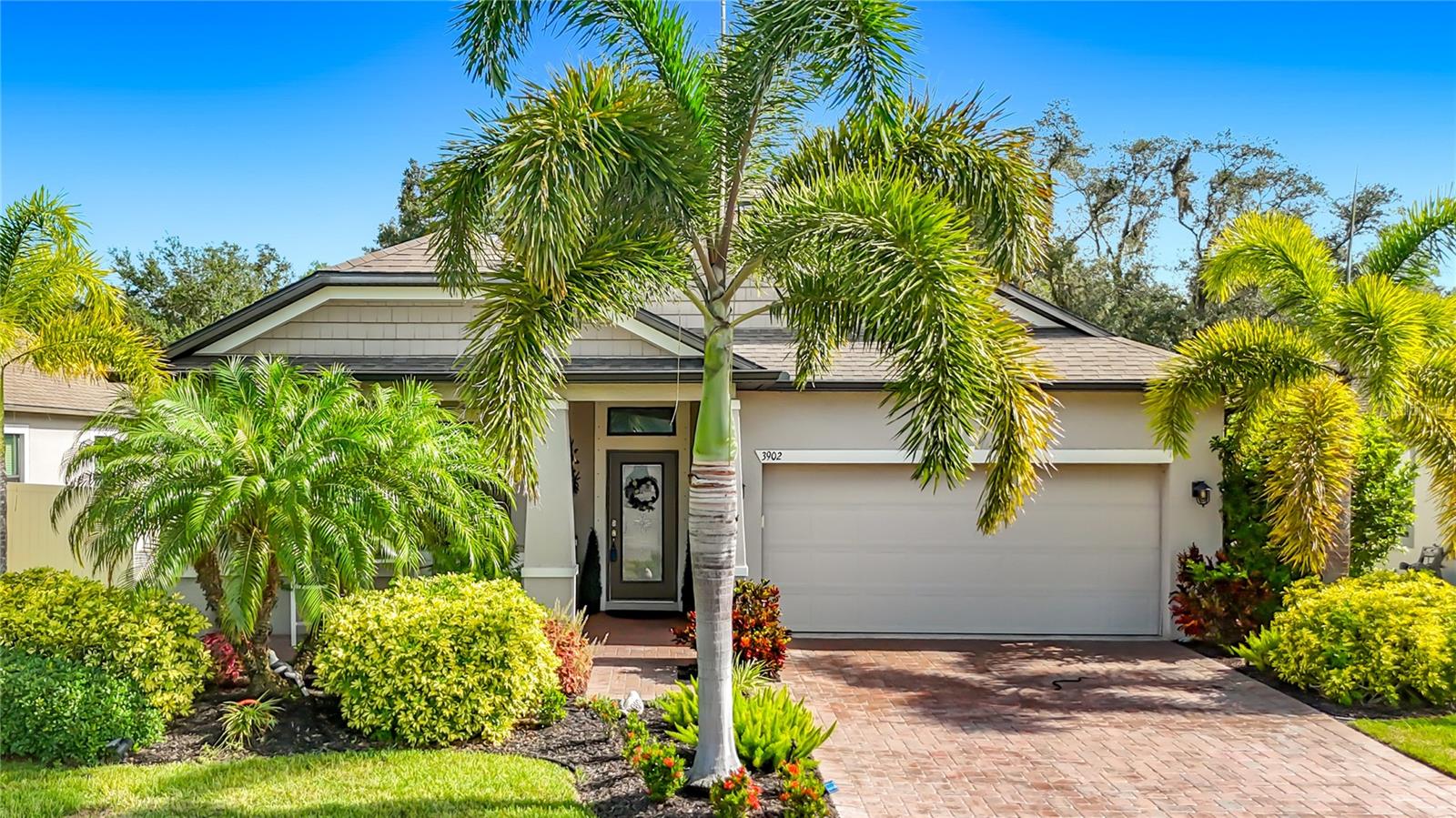 Comfort, style, and peace of mind come together in this beautifully maintained Palmetto home, ideally situated on a premium lot with no rear neighbors and no CDD fees.
Inside, thoughtful upgrades set this home apart. New luxury laminate flooring (2025) flows throughout, complemented by crown molding in every room and updated lighting that gives the entire home a fresh, designer feel. The primary suite features an elegant trayed ceiling, creating a true retreat at the end of the day. A versatile den offers flexibility as a home office or fourth bedroom, while a bonus area between the additional bedrooms provides the perfect spot for a reading nook, study space, or play area.
The list of recent improvements continues: a new A/C (2025) with a transferable warranty, a new dishwasher (2026), and fully paid solar panels that deliver energy savings from day one. A whole-home surge protector adds an extra layer of protection, and the irrigation system draws from the community pond, keeping the lawn lush without driving up the water bill.
Outside, the lanai and garage both feature epoxy-coated floors backed by a lifetime warranty, and ceiling-mounted storage racks in the garage keep everything organized and off the floor.
With its private backyard setting, low-maintenance upgrades, and move-in ready condition, this home offers the rare combination of style, comfort, and value.