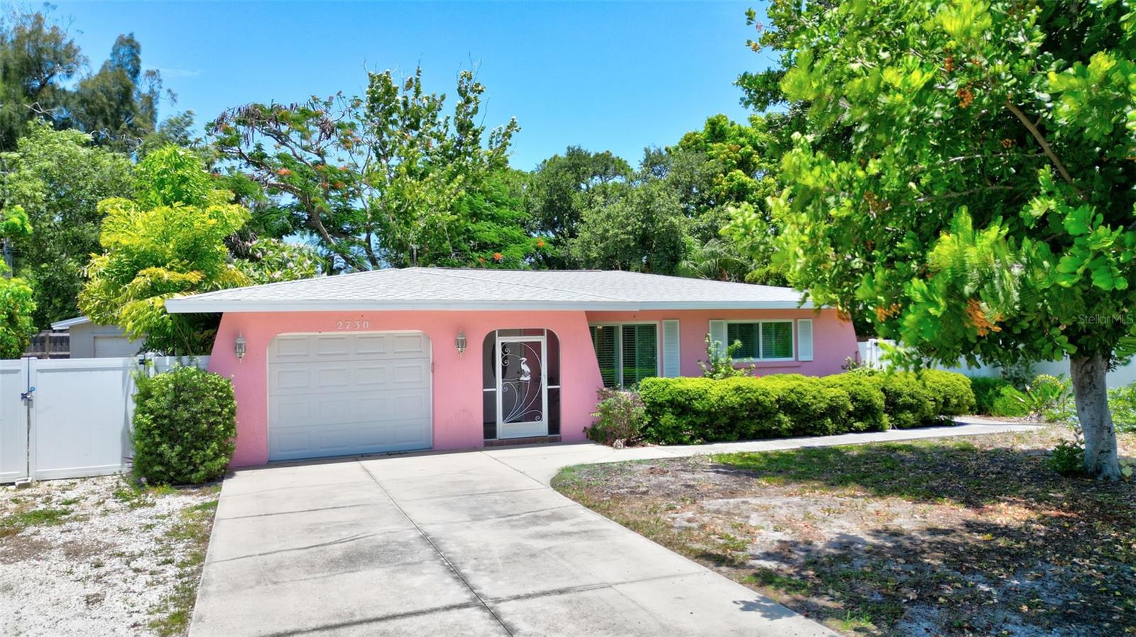 Experience easy, low-maintenance Florida living in this charming, well-maintained South Venice home featuring 2 bedrooms, 1 bathroom, and a spacious enclosed Florida room. **Terrazzo floors throughout—no carpet—**provide durability and timeless appeal, while the bonus room (about 400 sq ft of additional living space), finished with newer wood-look vinyl flooring and its own wall A/C unit, offers a flexible and inviting space. Currently used for both dining and additional living, it easily accommodates gatherings of 6–8 guests while still allowing room for a second sitting area, library, or studio. A separate spacious enclosed workshop with electricity adds exceptional value, ideal for hobbies, storage, or creative projects. Key updates include A/C (2024), roof (2016), and septic pumped (2026), along with impact windows, an impact-rated garage door with keypad, and a generator with upgraded electrical panel—providing added peace of mind. Inside, the main living area is bright and welcoming, enhanced by plantation shutters and a ceiling fan. The kitchen features wood cabinetry, additional storage, and space for a movable island or breakfast table, with convenient access to the garage and a separate laundry room complete with a window, built-in shelving, and a folding station. Both bedrooms feature walk-in closets, and the bathroom includes a tub/shower combination with linen storage. The fully fenced backyard creates a private outdoor setting with garden beds, planting areas, an outdoor shower, and a chiminea—perfect for relaxing or entertaining. Located in Flood Zone X (typically not requiring flood insurance) and approximately 10 minutes to Gulf beaches, with convenient access to Detwiler's Farm Market, Publix, Walmart, and Sarasota Memorial Hospital - Venice Campus. Seller is offering an enhanced one-year home warranty for added peace of mind. Come see for yourself the comfort, flexibility, and lifestyle this South Venice home offers—schedule your showing today.