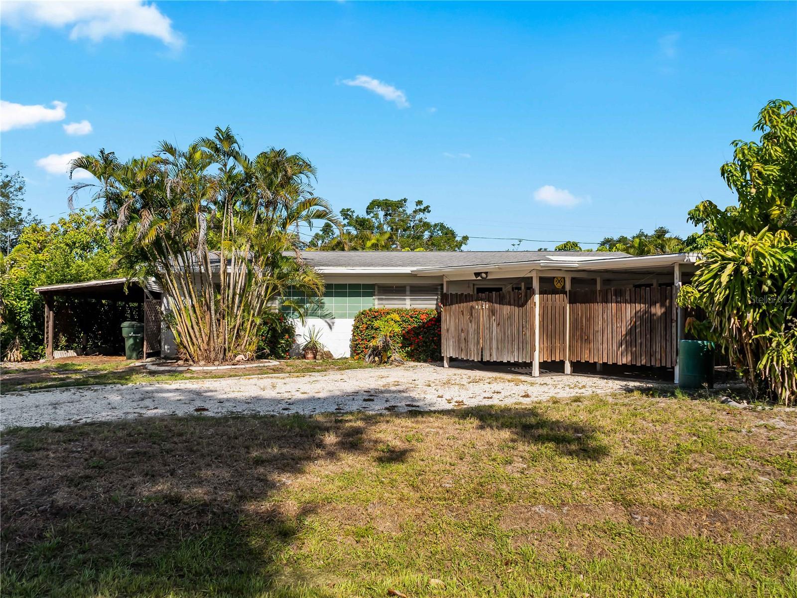 Welcome to 4328 Groveland Ave., Sarasota! This charming 3-bedroom, 1.5-bath home has been lovingly maintained by its ORIGINAL OWNER and is ready for its next chapter. Offering endless potential, this property provides the perfect opportunity to update and customize the space to match your personal style and vision. Major UPDATES have already been completed, including a NEWER ROOF (2020), HVAC system (2022), and WATER HEATER, giving you peace of mind for years to come. Outside, you'll find a 2-car covered carport plus an additional tandem covered carport, providing ample covered parking for multiple vehicles, a boat, or recreational toys. Step into the large, fully fenced backyard, where you'll find plenty of room to add the pool of your dreams, entertain family and friends, or simply relax and enjoy the outdoors. The yard is enhanced by mature landscaping and fruit trees, creating a peaceful Florida setting. For added storm protection, the home is equipped with CLEAR-PANEL HURRICANE SHUTTERS. Nestled in a quiet, established neighborhood in the heart of Sarasota, this home offers an unbeatable location just minutes from world-famous beaches, shopping, dining, medical facilities, the Tamiami Trail, and Interstate 75, making commuting a breeze. Located within the desirable Riverview High School district, this property is ideal for a variety of buyers. Whether you're a first-time homebuyer, an investor, or someone looking to create your dream home, this is a fantastic opportunity to own a well-built home in a prime Sarasota location. Come explore the possibilities and imagine making this house your future home!