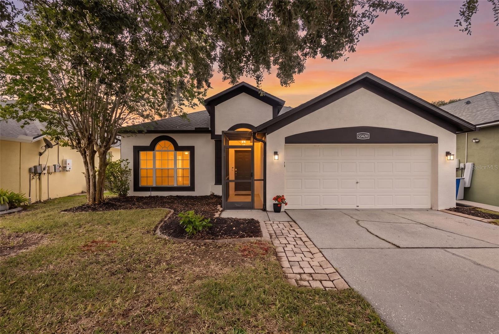 Land O’ Lakes was named Redfin’s hottest neighborhood of 2026, and this updated Sable Ridge pool home shows exactly why the area is getting attention. Move-in ready with major updates, a screened saltwater pool, sun shelf, water features, covered lanai, fenced backyard, and split 4-bedroom floor plan, this home delivers the Florida pool-home features buyers search for most. Big-ticket improvements include roof 2022, water heater 2024, exterior paint 2024, and A/C 2025. Inside, the front living and dining rooms create a memorable first impression with rich accent walls, defined entertaining space, and a polished, comfortable feel. The kitchen features stainless steel appliances, gas range, recently refinished countertops, and an easy connection to the eat-in dining area and main living room. The main living room looks directly to the screened outdoor living area, creating a strong indoor-outdoor connection to the saltwater pool, covered seating area, fenced yard, and backyard retreat. The primary suite is positioned off the living room with pool views, refreshed en-suite bath, frameless shower, soaking tub, dual vanities, and custom walk-in closet. Three secondary bedrooms are located on the opposite side of the home, with two bedrooms near a full bath and a rear bedroom that can serve as an office, fitness room, guest room, or flex space. Sable Ridge is a deed-restricted Land O’ Lakes community near the Land O’ Lakes Recreation Complex, Land O’ Lakes Public Library, Collier Parkway, US-41, SR-54, Suncoast Parkway/Veterans Expressway, Tampa Premium Outlets, The Shops at Wiregrass, AdventHealth Center Ice, area dining, grocery, parks, and Tampa International Airport.
