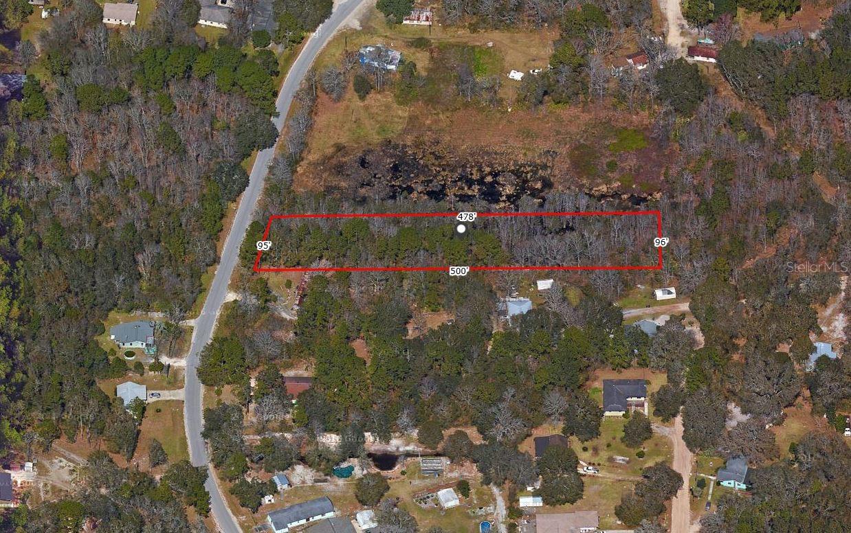 1.17-acre vacant lot in Middleburg, FL with ELECTRICITY and PAVED ROAD access already in place — over 50,000 sqft of opportunity ready for your vision, NO HOA restrictions.