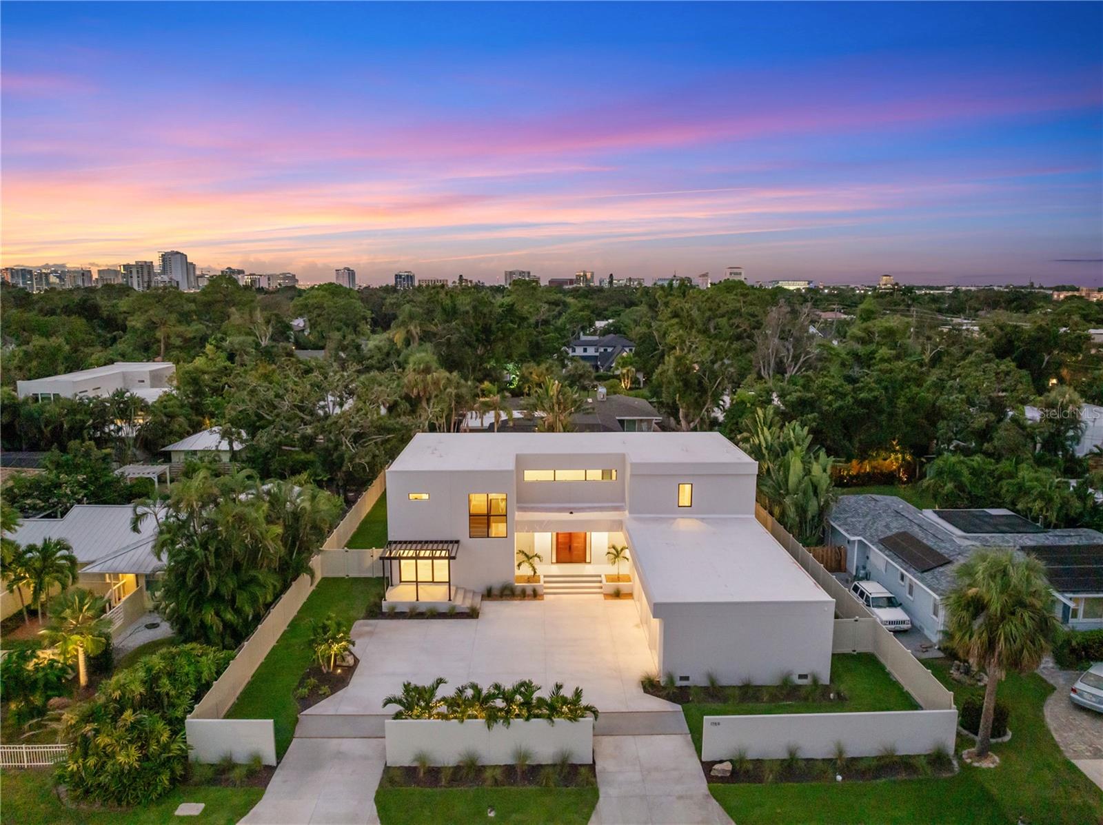 Virtually Staged. West of Trail luxury meets modern innovation at 1759 Waldemere Street. This brand-new, custom-built residence embodies timeless design, contemporary craftsmanship, and intentional indoor–outdoor living.

Set on a .33-acre lot just steps from Southside Village and Sarasota Memorial, the home delivers sophistication, convenience, and exceptional attention to detail in one of Sarasota’s most sought-after neighborhoods — a rare opportunity in the coveted West of Trail community.

Spanning 4,513 square feet, the two-story floor plan features four bedrooms, five baths, an office with private entry, and a media room that opens to a 480-square-foot balcony overlooking the property. Designed for both everyday living and elegant entertaining, the home showcases expansive sliding glass doors that blur the line between indoors and out, opening to a heated saltwater pool, spa, and lush landscaped backyard for year-round enjoyment.

The designer kitchen serves as the heart of the home, featuring Sub-Zero and Wolf appliances, custom cabinetry, imported stone, and a hidden butler’s pantry.

The first-floor primary suite epitomizes luxury with zero-corner sliders that open directly to the pool and outdoor living area. Inside, a spa-inspired bath includes a freestanding tub, walk-in shower, and a custom built-in walk-in closet.

Upstairs, two en suite bedrooms and a second-floor primary suite give privacy for family or guests. A versatile media room and expansive outdoor terrace complete the level, overlooking the serene backyard oasis.

Every detail has been thoughtfully curated — from the bespoke, locally handcrafted Sapele wood entry door to hurricane-impact windows and doors, a three-car garage with epoxy flooring, and professional landscaping surrounding the fenced backyard.

Ideally located in the highly regarded Southside Elementary School district, near Sarasota Memorial Hospital and the shops and dining of Southside Village, with downtown Sarasota, Siesta Key, Lido Key, and St. Armands Circle just minutes away.

This is more than a home — it’s a statement of Sarasota luxury living.