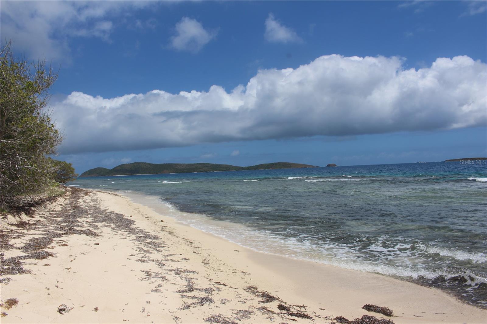 This 26 acre lot sits above Playa Larga and has enough elevation to provide a bird’s eye view of the spectacular surrounding turquoise waters along with the neighboring islands of Culebrita and St. Thomas in the distance.  The property is located on the eastern side of Culebra which receives refreshing trade winds for most of the year. The land drops to beautiful Larga Beach.