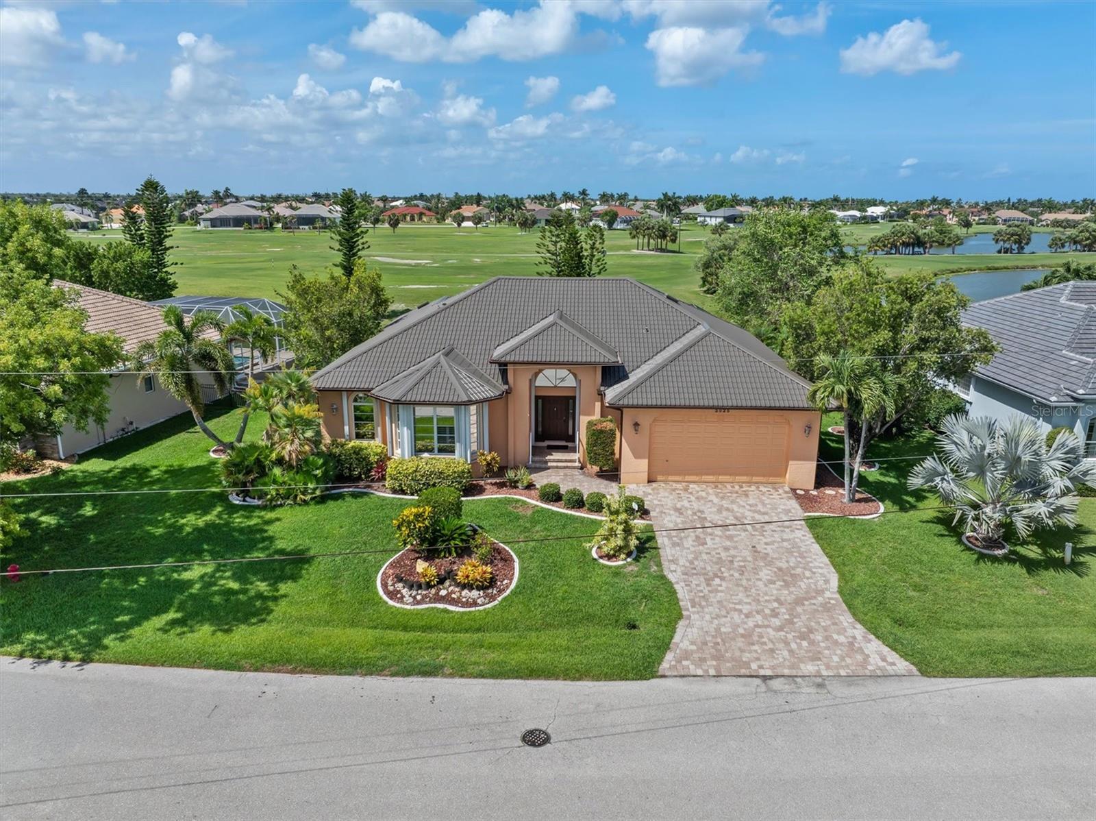 Golf course lifestyle in desirable Burnt Store Isles. Low HOA, high value. This immaculate fairway-view home offers sweeping greens and peaceful vistas ideal for golfers and Florida lovers. This bright open floor plan of 2,674 square feet features generous living spaces, a large eat-in kitchen, and a private master suite with scenic outlooks. Some of the most recent updates are a new Metal Roof replaced in 2024, HVAC replaced in 2024 and Hot Water Heater replaced in 22025.  Guest Bedroom 2 has built in cabinets/desk for someone looking for office space or a crafter.  In Bedroom 3 your guests would have a Pool/lanai view. Outdoor living shines with a covered lanai perfect for al fresco dining and sunset watching. Located in a premier golf and boating community with marina access nearby and close proximity to shopping, dining, and Punta Gorda conveniences. Low HOA fees make ownership affordable for seasonal buyers, and investors seeking rental potential. Don’t miss this opportunity to own in Burnt Store Isles, where golf, boating lifestyle, and resort-style Florida living come together.