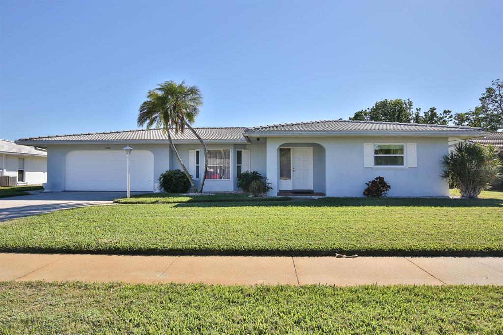 GULF GATE WOODS GEM! This home has been lovingly maintained by its "Snow Bird" owners. New AC in 2022. Large eat in kitchen over looking pool. You will be impressed from its wonderful curb appeal and throughout the home that is immaculate and "move-in ready". Large master suite with abundant closet space and open access to the lanai and caged pool. The oversized two car garage has ceramic tile floor with built in cabinets. Large separate laundry wing with cabinets and countertops. Located in one of Sarasota's most desirable neighborhoods close to schools, churches, shopping, "state of the art" public library one block away and the eclectic vibe of Gulf Gate Village with its wide variety of restaurants and nightlife. Most of all its just minutes to world famous Siesta Key and its sugar sand beaches. Ready for a new owner to enjoy the Florida lifestyle in a wonderful home.