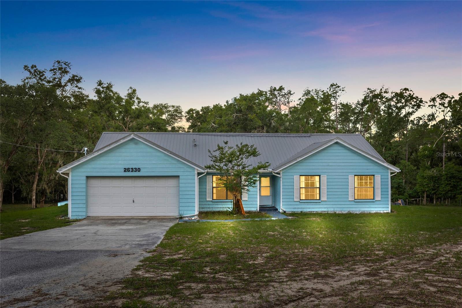 Opportunity, space and privacy in Brooksville! Situated on a spacious, wooded homesite, 26330 Blackjack Street offers a peaceful country setting with plenty of room to enjoy the outdoors. The property features mature trees, expansive open yard space, a gazebo, outdoor deck area, screened porch and an attached two-car garage.

Several of the big-ticket improvements have already been addressed, including a newer metal roof and HVAC system (JUNE 2024). The home also features an OWNED solar system with two newer inverters located in the garage, providing the benefits of solar without taking over a solar lease.

Inside, the home offers a spacious floor plan with abundant natural light, hardwood flooring in portions of the living areas, generously sized rooms and an eat-in kitchen with ample cabinetry. The interior is ready for updating, giving the next owner an excellent opportunity to renovate and personalize the home to their own taste while benefiting from several major improvements already completed.

Enjoy the privacy and flexibility of a large property surrounded by natural Florida landscape while still having plenty of usable open space around the home.

Property is being sold as part of an estate; however, the estate is prepared for sale and ready to close upon execution and completion of an acceptable contract.

Whether you’re looking for a primary residence, a property with room to spread out, or an opportunity to add value through cosmetic improvements, 26330 Blackjack Street offers tremendous potential
