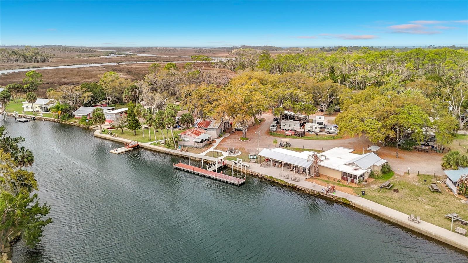 Take a look at this opportunity to live on an Island!! These lots rarely come available, and this one is ready to build on, slab is in place and possible impact fee credits. Manufactured home removed and leaving you with a clean slate to build a beautiful home. Second lot also available just north of this lot. Very near Mary's Fish camp and miles of side creeks and canals to explore. Nearly a direct route to the Gulf for great fishing and boating.  Move out here and forget about the world and enjoy peace and quiet and all the water fun you could dream .