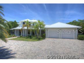 5 bed 5  bath gated riverfront estate seems park-like with over 1 acre of manicured tropical landscaping & 150ft of direct river frontage with seawall; truly 1 of a kind. Upon entering the home you are greeted by the impressive grand staircase, and the custom paddle ceiling fan above; both are centerpieces in their own right. Hardwood floors lead past the formal dining room, into an open floor plan family room & kitchen. The main living room & casual dining area is open and spacious & include marble gas fireplace, built-in entertainment center & adjacent alcove affords magnificent views of the intracoastal via 5 large bay windows. Gourmet kitchen is well designed in taste & efficiency; granite counter tops, triple-bowl sink & sleek stainless GE Monogram appliances. The kitchen connoisseur in your life will appreciate custom details like; double oven featuring GEs Advantium oven & large prep/bar island w/sink & ice fridge. Plentiful, spacious cabinets & custom walk-in pantry provide ample space for accessible storage. The large window floods the kitchen in natural light & also makes sunsets & sailboats the backdrop to your life. This home sits on the intracoastal & includes private boat dock & lift so life on the water has never been easier. Home also features; a free form pool & spa, beautifully pavered deck & driveway & wrap around porches. Large laundry room has custom cabinets, fold out ironing board, & hanging rack. Off the living room, the master suite features his & hers walk-in California closets, & private access to pool patio via French doors. Master bath is spa-like, complete with his & her sinks, oversized walk-in shower w/ triple shower heads & claw-foot bath tub. 3 guest bedrooms w/private baths & bonus room perfect for an office or 5th bedroom. 2 car attached garage plus 4 car detached perfect for a workshop or storing your toys.UNCOMPARABLE SUNSETS!!! ;Water: City