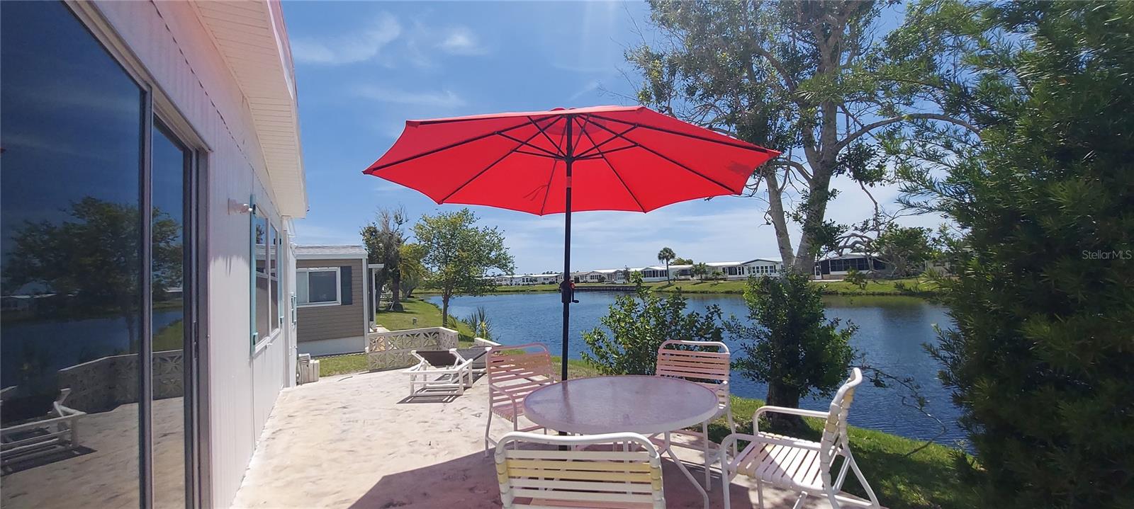 Lazy River Village is Sarasota County’s premier 55+ waterfront community on the Myakka River. This updated double wide home offers 1344sq.f under heat with new roof and new ceilings throughout in 2024. Extensively improvements in 2026 include updated vapor barrier, 
 brand new kitchen, stainless steel appliances, updated subfloors, brand-new water-resistant laminate, updated bathrooms with new shower in master bath. Fresh paint in-and outside.  2020 Water heater.

Living room is open to the dining room and offers views of the lake. The primary suite offers plenty of room for a king bed with walk-in closet and great natural light. Both bathrooms have walk in showers.Large terrace outside offers perfect place for sun bathing and relaxing.  

A low monthly fee of $288 covers ground maintenance, clubhouse Wi-Fi, cable, in-home internet and amenities like tennis, pickleball, bocce, fitness center, pool and spa, bike club and card clubs, shuffleboard, professional woodworking shop, and putting green.  
There are other amenities for an extra fee, such as a marina slip if your home is not located on the water or storage for RV or boats.