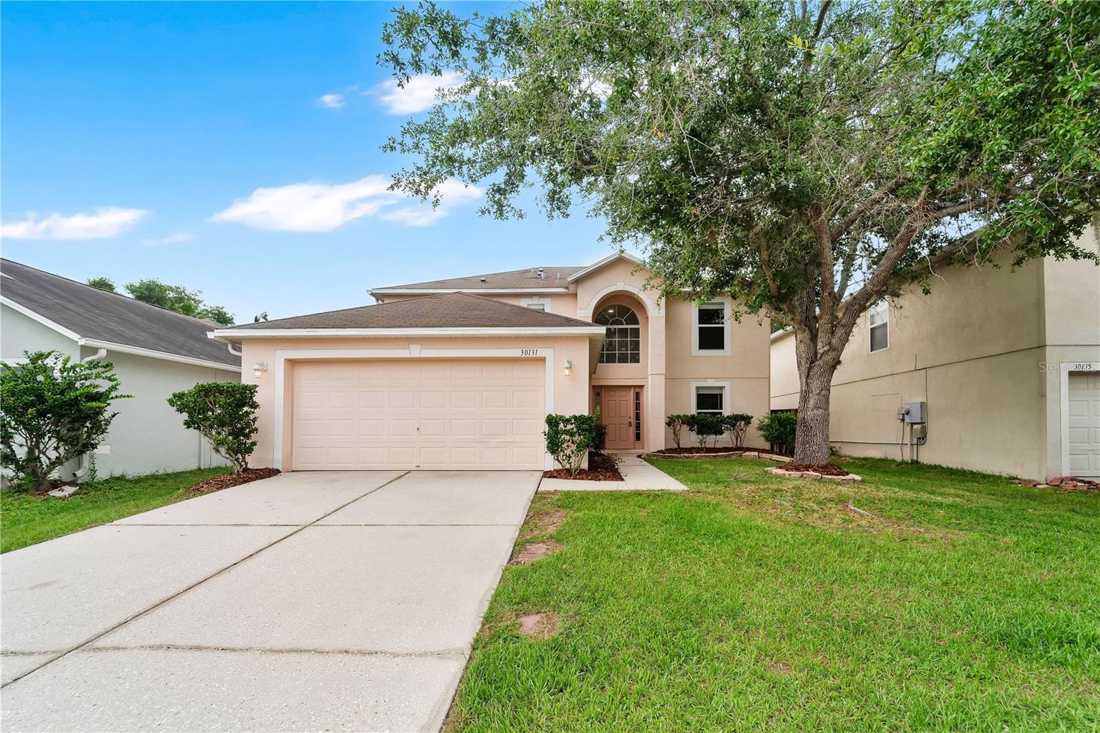 This 4-bedroom, 2.5-bath home in Wesley Chapel's Chapel Pines comes with up to $15,295 toward closing costs or a rate buydown. Inside: fresh interior paint, new stainless steel appliances (Whirlpool glass-top range and dishwasher, plus a stainless microwave), updated lighting and fixtures, and a full cosmetic refresh. A new roof is scheduled, pending final HOA approval, so the buyer gets it without the cost. Downstairs, the kitchen opens to the main living areas, with sliding glass doors to the backyard, and a first-floor bonus room works as a home office, playroom, or formal dining. Upstairs, the primary suite has a private ensuite bath, with three more bedrooms sharing a second full bath. The backyard is fully fenced. Chapel Pines carries a low HOA, low taxes, and no CDD, an uncommon mix in Wesley Chapel, and sits minutes from The Shops at Wiregrass, Tampa Premium Outlets, schools, dining, medical facilities, and major highways. Tour every room with the 3D virtual tour, then book a private showing. Buyer incentive available when using the Seller's preferred lender; subject to lender approval, loan-program restrictions, and the terms in the executed contract.