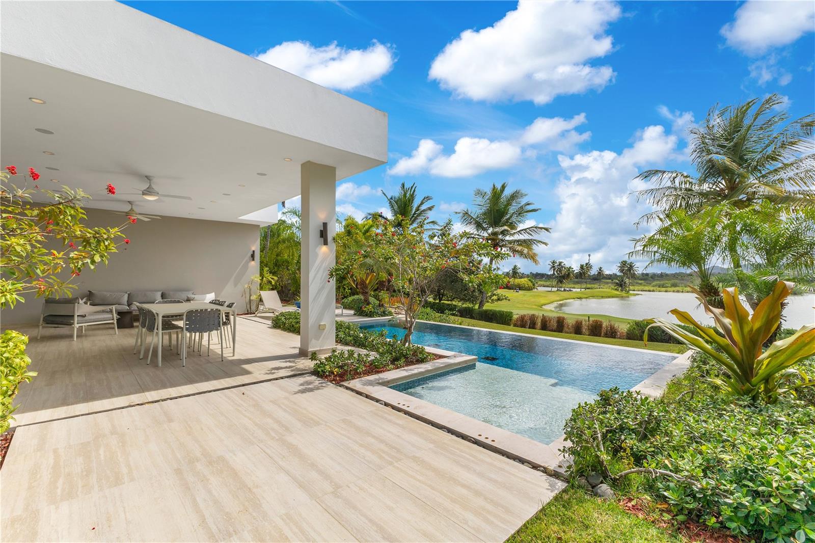 Come and experience living in Enclave, one of the most exclusive communities in the coveted Dorado Beach Resort, this stunning one-story residence offers an unparalleled blend of luxury, comfort, and breathtaking views. Spanning 3,453 sqft. of elegantly designed, conditioned living space on a 1,227 sqmt. lot, this 4-bedroom, 4-bath, and 2 half-bath home is a true sanctuary. All bedrooms have en-suite bathrooms great for privacy. The open-concept layout and soaring ceilings in the living area create a sense of spaciousness, enhanced by an abundance of natural light.

Enjoy serene lake and golf course views from the covered terrace and private pool—perfect for outdoor entertaining. The modern kitchen offers ample storage and panoramic views of the lake. The master suite is a tranquil retreat with direct backyard access, a spacious walk-in closet, and a spa-like master bath featuring dual showers, a soaking tub, and an outdoor shower for a resort-style experience.

Dorado Beach Resort and Club offers access to a wide range of world-class amenities, including the Sports Hub, Fitness & Wellness Center, Tennis Center, and a variety of restaurants. Enjoy the convenience of being close to everything you need for a comfortable and vibrant lifestyle.