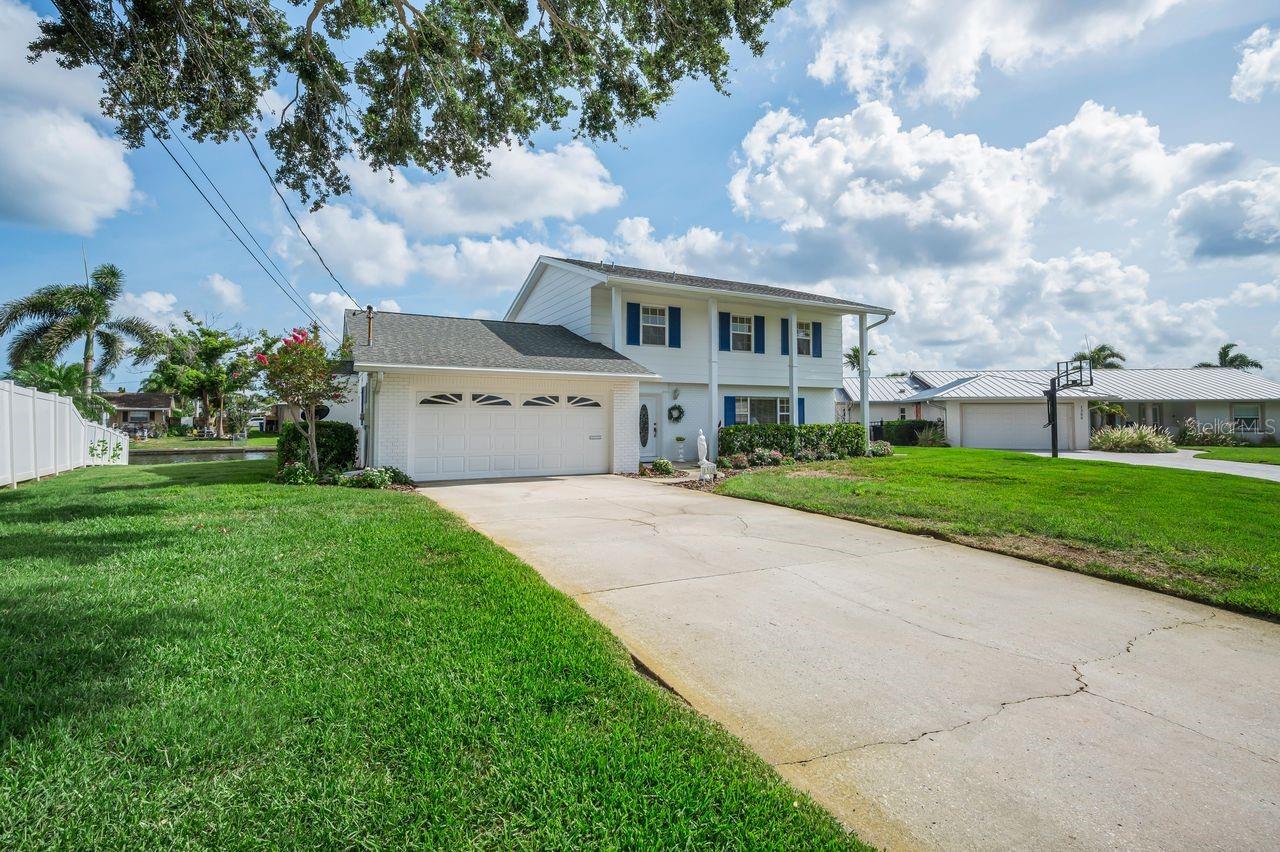 Nestled on a quiet cul-de-sac in the desirable Patrician Point neighborhood, this well-maintained waterfront home is being offered by only its second owner. Situated on a canal with a private dock, the property offers the ideal setting for enjoying Florida waterfront living.

Inside, you'll find a newly updated kitchen featuring modern white and gray finishes, creating a bright and stylish centerpiece for the home. The spacious two-story layout provides comfortable living areas, including a family room with a fireplace that serves as an attractive focal point. On entry, you'll see a spacious living room attached to a dining room overlooking the water.

Outdoor living is where this home truly shines. A large, screened porch overlooks the water and provides ample space for entertaining or relaxing year-round. Beyond the porch, there is plenty of backyard space to add a pool while still maintaining room to enjoy the waterfront setting. Upstairs, a generous balcony offers panoramic canal views and the perfect spot to enjoy morning coffee or evening sunsets. Upstairs AC 2024 and downstairs 2020. Roof 2014.

One of the best things about Patrician Point - unlike other water frontage, you don't have to drive through high tide flooding to get home. With its waterfront location, private dock, spacious outdoor living areas, updated kitchen, and sought-after Patrician Point location, this home presents an exceptional opportunity to enjoy the Florida lifestyle. Close to the bridge for quick boat access out to Tampa Bay.