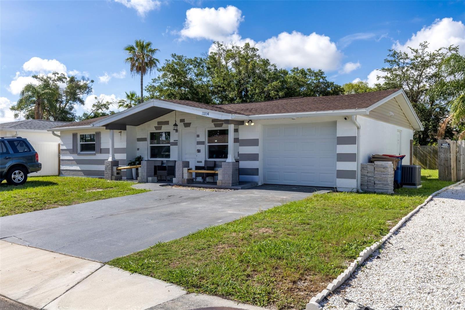 Move in ready 3 bedroom 1.5 bathroom home located in Holiday Fl. This home has and update kitchen with quartz countertops and shaker style cabinets. The seller has taken care of all the big ticket items! These include the Roof (2023), Electric Panel (2022), Water Heater (2022), Impact rated garage door (2022), HVAC(2023), and Windows (2023). Conveniently located near restaurants and shopping, this home is ready to go!