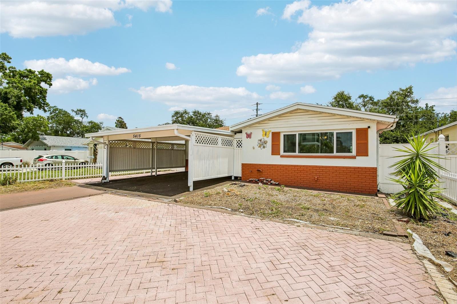 Hidden gem in plain sight! This 3/2/1 pool home checks a lot of boxes... Fantastic location in Northeast St Pete! Concrete block construction, newer hurricane impact windows and doors, pool and spa, garage with additional carport, extra private parking, and inside laundry room. Some TLC needed, but nothing outrageous. Add some flooring and pool upgrades and you're good to go OR update to your taste. Must see to fully appreciate!