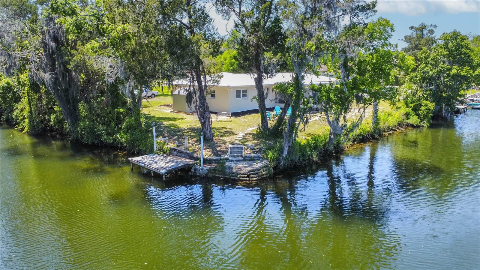 Crystal River WATERFRONT HOME NOT DAMAGED by Helene or Milton! NOT in City limits so great rental potential. Enjoy the property as often as you wish, then allow the rental income to cover expenses.  Current owner grossed approx. $30K in 2025 and $15K is reflected so far for 2025 while they enjoy weekend get-aways! Over 1/4 acre directly on wide open water with protected dock plus onsite storage space for all the "toys". GREAT fishing right from your backyard!  Cast a line while you watch the beautiful dolphins & manatees play and entertain you. Enjoy an easy, peaceful boat ride from your dock to Pete's Pier for gas and bait, great restaurants, Three Sister Springs or out to the Gulf. This beautifully remodeled 3/2 home boasts a new metal roof, new kitchen, new flooring, all fresh paint inside and out, plus updated bathrooms. Peaceful Crystal River is a Florida treasure! This is an opportunity to secure a permanent home, investment opportunity or weekend getaway. This gem is priced to sell!