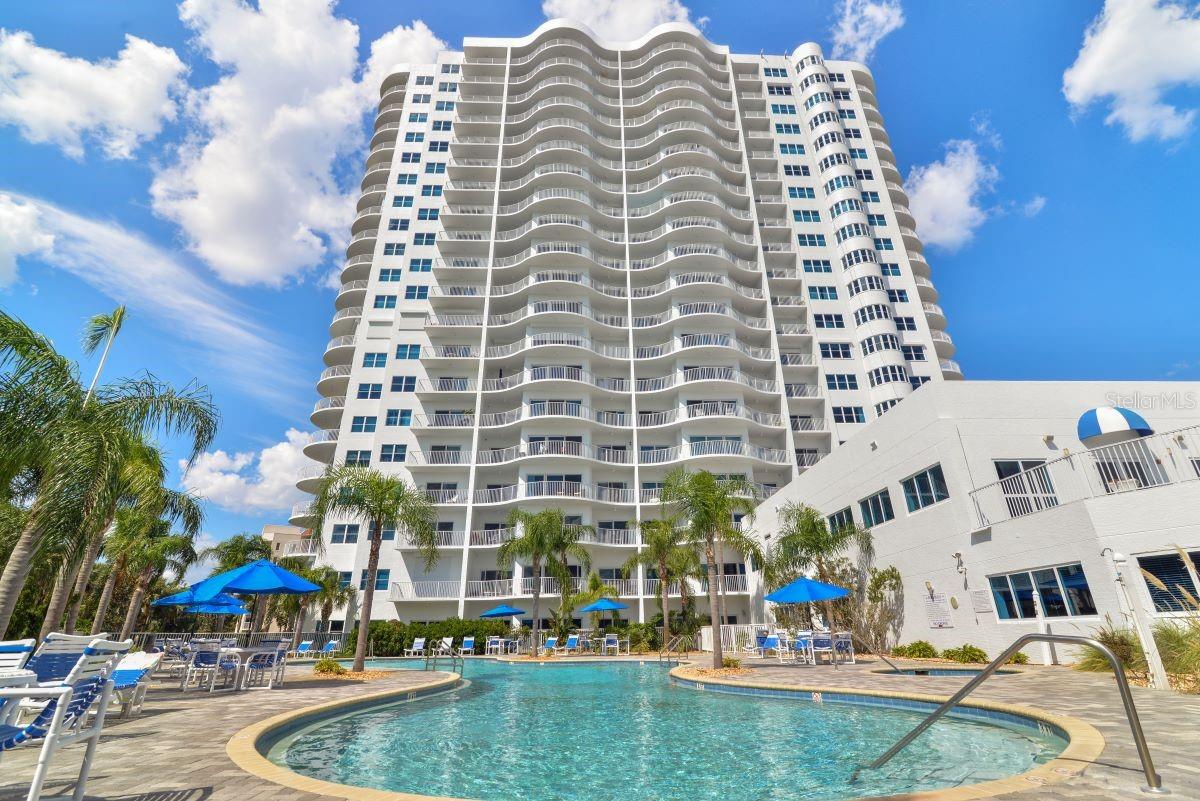 AN ARCHITECTURAL MASTERPIECE! NOTHING SHORT OF SPECTACULAR! LOCATED IN THE EPICENTER OF DAYTONA BEACH SHORES, A SCENIC COASTAL CITY ALONG THE ATLANTIC OCEAN. THIS COASTAL GEM IS UPGRADED WITH ALL THE SHIFTING BUYER PREFERENCES! EVERYTHING INSIDE THE DOUBLE-DOOR ENTRY IS LUXURIOUS! THE OVER-SIZED TILE FLOORING, THE LAYERED LIGHTING, THE PRIVATE PRIMARY SUITE, THE 3 SEPARATE BALCONIES THAT SHOWCASE SUNRISE AND SUNSET VIEWS FOR OPTIMAL PLEASURE AND BOTH OCEAN AND RIVER VIEWS! THE TIMELESS APPEAL OF A BLUE AND WHITE KITCHEN THAT WAS THE INSPIRATION FOR A SERENE, COASTAL VIBE. THE CABINETS ARE THE BACKBONE OF THIS DREAM KITCHEN. QUARTZ COUNTERS AND LARGE POLISHED PORCELAIN FLOORING COMBINE FOR A CLEAN, COHESIVE LOOK WITH CHARM. FORM FOLLOWS FUNCTION IN THIS ISLAND KITCHEN WITH AN ADJACENT OFFICE AND CURVED GLASS WINDOWS THAT LOOK LIKE A SCULPTURE. THE BAR GRACEFULLY CONNECTS TO THE DINING SPACE WITH CUSTOM BRUSHED GOLD LIGHTING. ENTER THE GUEST WING THROUGH THE GALLERY FOYER THAT IS

ULTIMATELY PRIVATE AND BOTH BEDROOMS LEAVE NOTHING TO BE DESIRED, EACH WITH THEIR OWN FULL BATH AND DIRECT RIVER VIEWS. THIS CONDOMINIUM ESTATE OFFERS A CHIC STYLE WITH AN UNPARALLELED LIFESTYLE SURROUNDED BY WALLS OF GLASS IN A COASTAL CITY. 5 STAR AMENITIES INCLUDE A PALATIAL SWIMMING POOL & SPA, A LOUNGING DECK SURROUNDED BY PALM TREES, THE POOL SIDE GYM AND SAUNAS, WITH EASY INDOOR/OUTDOOR ACCESS. WITHIN WALKING DISTANCE TO THE COMMUNITY CENTER, A THRIVING CITY CENTRE WHERE RESIDENTS MEET FOR CLASSES, CONCERTS AND CELEBRATIONS. WALKING DISTANCE TO GOLF & RACQUET CLUBS, GROCERY SHOPPING AND BANKING. YOU CAN HAVE IT ALL! THIS EXCEPTIONAL LOCATION OFFERS ABSOLUTELY EVERYTHING AT YOUR FINGERTIPS ALONG THE BEACH!
