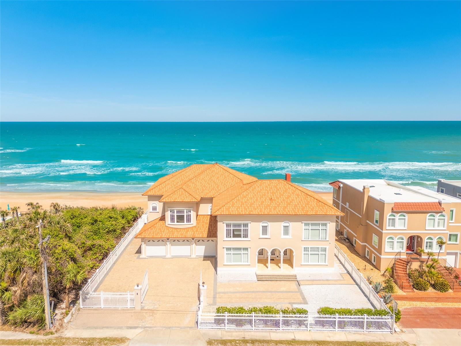 A Once-in-a-Lifetime Opportunity to Own a Piece of Ormond Beach History. Welcome to 33 Ocean Shore Boulevard, a breathtaking oceanfront estate that is as rich in history as it is in grandeur. Known as the Prettyman House, this historical landmark, built in 1918, has been lovingly restored to preserve its original charm while seamlessly incorporating modern luxuries. Once the esteemed Villa Mar Oceanfront Bed & Breakfast, this extraordinary property presents a rare opportunity to own an iconic residence in one of Florida’s most sought-after coastal communities.

Spanning an impressive 8,744 square feet, this eight-bedroom, eight-and-a-half-bathroom estate is the epitome of luxury living. The meticulous restoration highlights exquisite architectural details, from elegant crown moldings, baseboards, and shoe moldings to the stunning combination of oak hardwood, marble, and tile flooring. Each room radiates timeless elegance, enhanced by top-of-the-line fixtures and finishes that define estate-quality living.

Nestled on a 0.34-acre lot, this direct oceanfront property boasts an enviable 90 feet of pristine coastline in Ormond Beach’s exclusive “No Drive” zone. The estate offers countless opportunities to bask in coastal beauty, whether enjoying the sunrise from the private waterfront loggias, unwinding in the spa room, or gathering in the stately foyer by the fireplace.

From the moment you step through the grand entrance, you are welcomed into an elegant formal living room, where a fireplace and breathtaking ocean views create an atmosphere of timeless charm. Just beyond, two spacious first-floor bedrooms, each with their own en-suite bathroom, offer comfort and privacy—one with direct access to the pool deck, inviting you to step outside and soak in the coastal breeze.

Moving through the vestibule, you’ll find an additional living area that seamlessly transitions into the grand kitchen and dining room, where expansive windows frame the stunning ocean backdrop. Designed to accommodate both intimate gatherings and large-scale entertaining, the chef’s kitchen is a masterpiece, featuring commercial-grade stainless steel appliances, a dual gas-top convection oven, and exquisite finishes that elevate the culinary experience.

Ascending to the second floor, the primary suite is a true sanctuary, boasting panoramic ocean views, a private balcony, a spa-inspired en-suite bathroom complete with a Jacuzzi tub, his-and-her sinks, and a walk-in shower, as well as an office, work-out room, and a private spa room with a private shower for ultimate relaxation. The second floor also features four additional bedrooms, each with their own luxurious en-suite bath, adding to the home’s grandeur.

Finally, venture up to the third floor, where a private media room awaits - your personal media room to enjoy movie nights in absolute comfort, providing the perfect retreat for entertainment and relaxation.

This estate seamlessly blends historical charm with modern luxury. Equipped with system, a sprinkler system, a full-home generator, and a three-car garage with ample parking, every detail has been designed with convenience and peace of mind in mind. 
Rarely does a home of this magnitude, history, and prime location become available. This estate is truly a rare gem for those seeking the pinnacle of Ormond Beach luxury living.
Appointment Only. Proof of Funds Required.