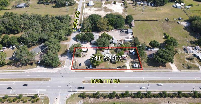 Centrally located in Riverview, FL, the area surrounding the property at 10022 Carr Rd presents an array of exciting opportunities for
commercial investment and/or development. The bustling Riverview area is known for its vibrant retail and business scene, with a range
of popular amenities and attractions nearby. Residents and visitors alike can enjoy the convenience of a variety of dining, shopping, and
entertainment options just moments away from the location. The owner of the property currently leases the land to individuals for parking. The leases can be terminated with short notice or could stay in place for a new owner.