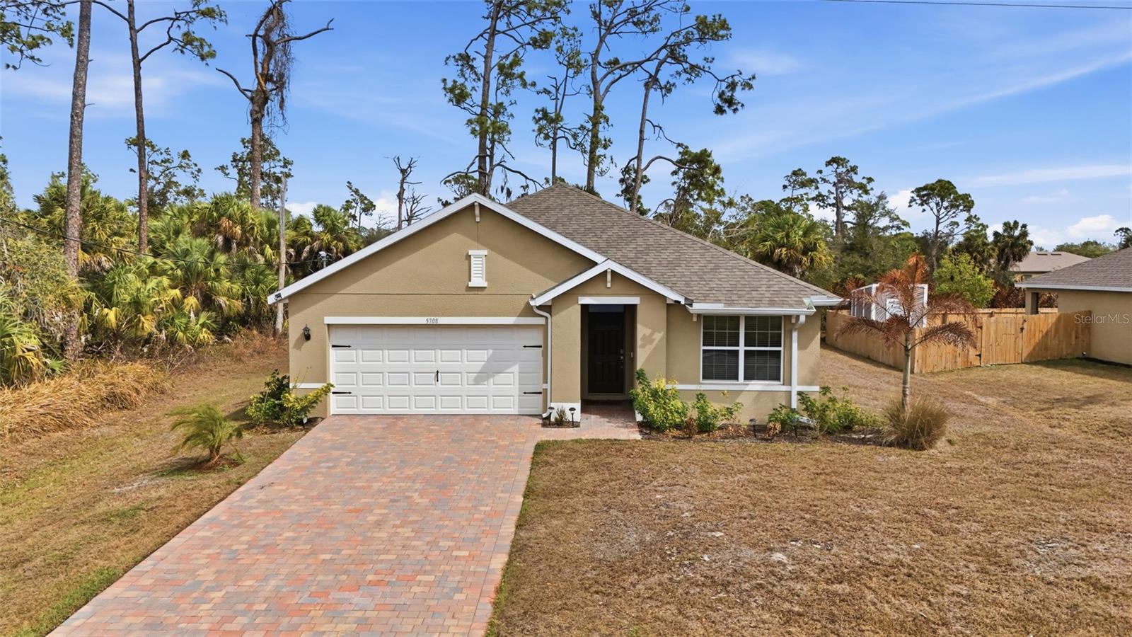 Welcome to this charming FURNISHED 3-bedroom, 2-bathroom home with a 2-car garage located in the heart of North Port. NO HOA FEES & NO FLOOD REQUIRED! CLICK ON THE VIRTUAL TOUR LINK 1 FOR THE VIDEO AND VIRTUAL LINK 2 FOR THE 3D TOUR.  Designed with comfort and functionality in mind, this home features tile flooring throughout the main living areas, high ceilings, and recessed lighting that create a bright and airy atmosphere. The open-concept living room offers the perfect space for entertaining friends and family, seamlessly connecting to the eat-in kitchen. You’ll love the modern kitchen complete with stainless steel appliances, quartz countertops, a breakfast bar, and a convenient closet pantry—ideal for both everyday living and hosting gatherings. The spacious primary suite provides a relaxing retreat with a large walk-in closet and a private en-suite bathroom featuring a dual-sink vanity and a walk-in shower. The split-bedroom floor plan ensures privacy, with guest bedrooms offering built-in closets and easy access to a shared guest bathroom nearby. Step outside to the screened lanai with privacy screening—perfect for sipping your morning coffee or unwinding with your favorite evening beverage while enjoying the beautiful Florida sunshine. The open backyard offers endless possibilities, whether you envision installing a pool or creating your own outdoor oasis. Conveniently close to US-41 for easy access to local favorites such as Cool Today Park, the North Port Aquatic Center, Atwater Community Park & the warm mineral springs, shopping, fine & casual dining, LIVE entertainment, and a short car ride to award-winning beaches! You won't want to miss out on this rare opportunity. Schedule your showing TODAY!