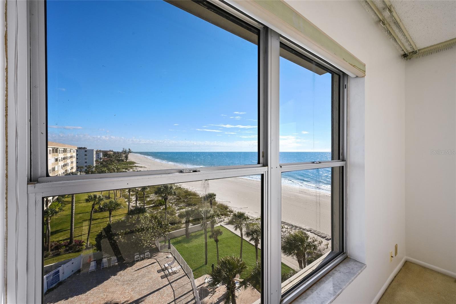 Two-bedroom, two-bath residence offering sweeping sixth-floor views of the Gulf of Mexico from Longboat Harbor Towers. This rare southwest corner condominium has completely unobstructed views west and south providing one of the most interesting and protected waterfront visages available anywhere on the key. In largely original condition, this spacious property presents an exceptional opportunity for renovation and customization in one of Longboat Key’s most coveted waterfront locations. Few properties combine this level of potential with such a remarkable setting. Positioned directly on the Gulf with more than 400 feet of pristine beach frontage, this fully amenitized community also enjoys eastern views of Sarasota Bay and the downtown Sarasota skyline—delivering breathtaking sunrises and sunsets from the same home. The southwest exposure also provides much more to view and enjoy with site lines extending down the entire length of the key. Common areas have been recently renovated and include a beachfront, heated, saltwater pool, a complete exercise room and spacious lounge with pool baths. Longboat Key is a sought-after barrier island community known for its relaxed coastal lifestyle, pristine beaches, and upscale residential atmosphere. Ideally located just minutes from the cultural and social energy of Sarasota, residents enjoy convenient access to world-class arts, dining, and entertainment while maintaining a sense of privacy and tranquility. A short drive south leads to iconic St. Armands Circle, renowned for its eclectic mix of boutiques, fine dining, cafés, and year-round events. Beyond St. Armands, downtown Sarasota offers theaters, galleries, live music, waterfront parks, and a thriving culinary scene, making Longboat Key an exceptional blend of island serenity and vibrant city living. This seller also has a BOAT SLIP for sale at The Boathouse, adjacent to the Dry Dock Restaurant just minutes away. Buy the condo and the slip for a complete Florida lifestyle!