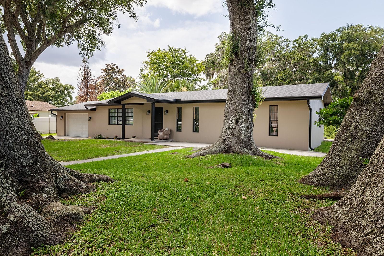 SELLER WILL CONTRIBUTE $10,000 TOWARD BUYER CLOSING COSTS WITH A FULL-PRICE $290,000 OFFER! Completely remodeled in 2026 and essentially new inside, this 3-bedroom, 2-bath South Daytona home sits on an extra-large lot and is conveniently located approximately 4.6 miles to Daytona Beach Shores beach access and about 5 to 6 miles to Daytona International Speedway. Step inside to a bright open living and dining layout with wood-look flooring, fresh interior finishes, crisp white trim, updated lighting, ceiling fans, and a clean neutral color palette throughout. The remodeled kitchen features white shaker-style cabinetry, marble-look countertops, stainless steel appliances, black hardware, and great natural light. Both bathrooms have been refreshed with stylish tile, updated vanities, and modern fixtures, including walk-in shower and tub/shower options. Outside, the oversized lot is framed by mature oak trees with space for outdoor living, gardening, entertaining, or future possibilities. Major updates include a 2025 roof, soffits, gutters, and new ductwork, making this a move-in ready home close to parks, shopping, dining, beach access, the speedway, and Daytona area attractions.