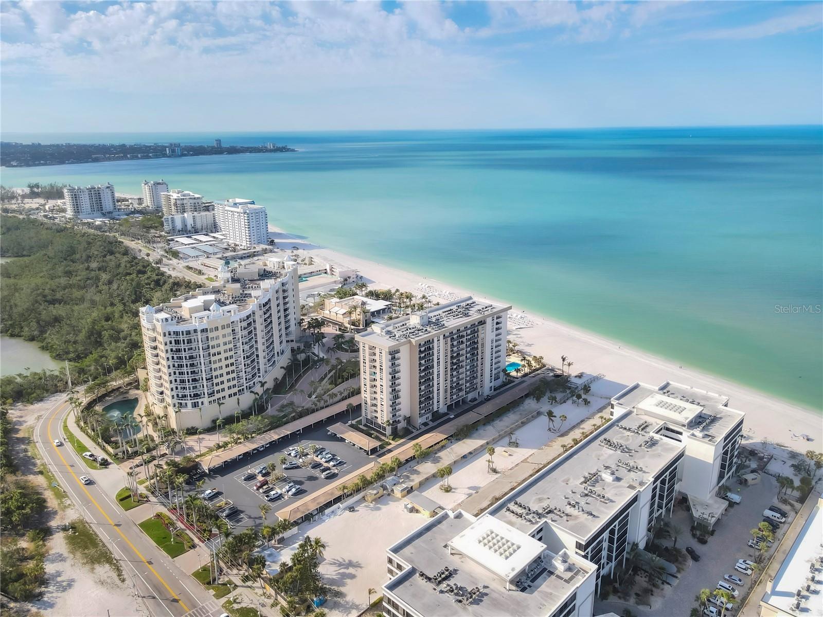 Gulf-Front Stunner on Lido Key, FABULOUS, FURNISHED, and MOVE-IN READY! Come and enjoy this dreamy 2-bedroom, 2-bath beachside retreat, perched on the 5th floor, and offering panoramic views from the sparkling Gulf waters to the iconic Ringling Bridge and Sarasota Bay. Located on the edge of the white sands of Sarasota's Lido Beach, this residence delivers the ideal balance of relaxation, luxury, and low-maintenance living. The Lido Beach Club is nestled among some of Sarasota's most desirable and luxurious beachfront properties, and only minutes from the boutiques, cafés, and fine dining of the renowned St. Armands Circle. Inside, enjoy light, breezy, coastal-inspired interiors, where you'll be indulged by stone countertops, and large rugs over easy-care porcelain tile flooring throughout. The open floor plan creates a comfortable space for entertaining or quiet evenings at home. Offered fully furnished, this turnkey condo is ready for immediate enjoyment. Ideal for year-round living, travelers seeking a sunny retreat, or investors looking for a strong rental opportunity, don't miss your chance to own a piece of Sarasota's coastal paradise and enjoy beachfront living at its finest.