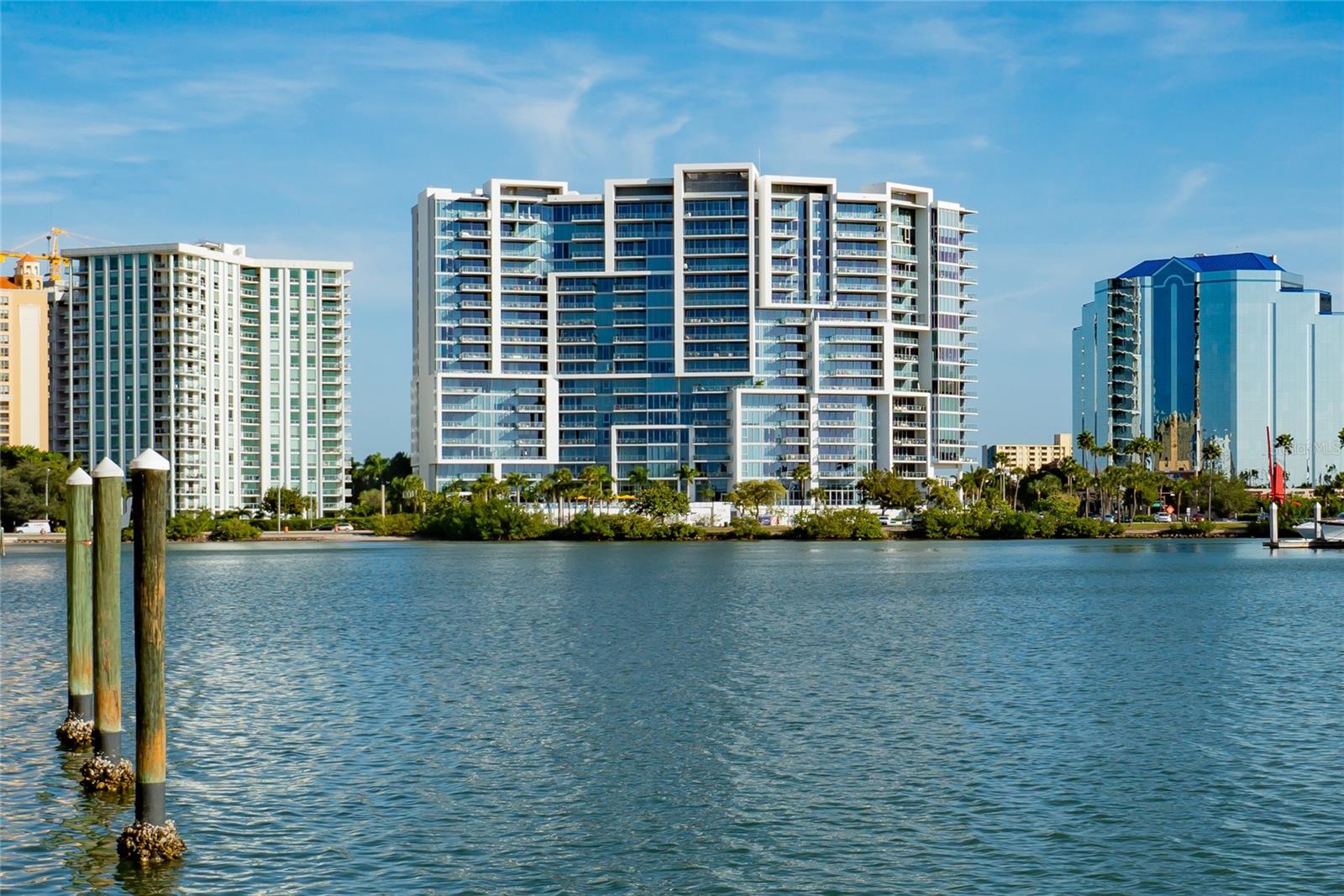 Panoramic views of Sarasota Bay shimmering through 10’ floor-to-ceiling windows greet you as you enter this sophisticated, light-filled condominium in one of the most distinctive buildings and desirable locations in downtown Sarasota. Step out of your private elevator and foyer into a personal sanctuary of luxury, privacy and convenience. Surrounding you in close proximity are all the exciting venues of Sarasota, with its rich cultural life of theatre, music and art, vibrant dining and shopping, and miles of white sugar-sand beaches. 
The spacious open floor plan provides welcoming flow for entertaining, as guests mingle and enjoy breathtaking views of the Bay, Marina and Gulf of Mexico beyond. The large great room is the heart of the home and adjoins seamlessly with a gracious dining area and striking black-and-white kitchen with high-end appliance and walk-in pantry. Two en suite bedrooms, a versatile den/office and an additional elegant full bath provide comfortable indoor living space. An airy balcony off the primary bedroom and great room invites you to take in the view over coffee in the morning or an evening cocktail.
The sophisticated, beautifully appointed interior features gleaming tile floors in the main areas, luxury vinyl in bedrooms and extensive custom cabinetry throughout.  Three large custom-designed closets, including an enormous walk-in off the primary bedroom, provide abundant storage for your wardrobe and more. A separate laundry room is located right off the private foyer. Additional climate-controlled storage in the lower level garage.
The iconic Vue Sarasota Bay sets a high bar for downtown living in Sarasota. It provides a full-service luxury lifestyle that combines security and privacy with a strong sense of community. A full schedule of events offers homeowners opportunities to socialize as much, or as little, as they choose. Full-time concierge service, valet parking, and on-site management are among the myriad amenities enjoyed in the building. Two dedicated parking spaces in garage make transportation easy. If you enter through the elegant main lobby, you are welcomed by cordial staff and approximately 7,000 square feet of interior common space, including a formal owner’s lounge with fireplace, bar and catering kitchen—all overlooking a resort-style pool with outdoor grills and sundeck perched above Sarasota Bay. A fully-equipped fitness center and rooftop dog park meet the exercise needs of owners and their furry friends.
Expecting guests? The luxury Westin Hotel is right next door, offering four-star accommodations and dining, plus a rooftop pool and bar with spectacular views. 
You will be wowed the moment you walk into #509 at The Vue--and entering a lifestyle of your dreams if you stay!
